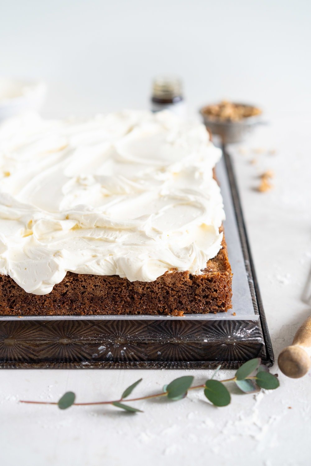 Brown Butter Carrot Sheet Cake is taken to the next level with a fluffy, whipped vanilla bean cream cheese german buttercream. This cake comes together super easily but is super delicious, and would make the perfect easter dessert. #brownbutter #carrotcake #sheetcake #germanbuttercream