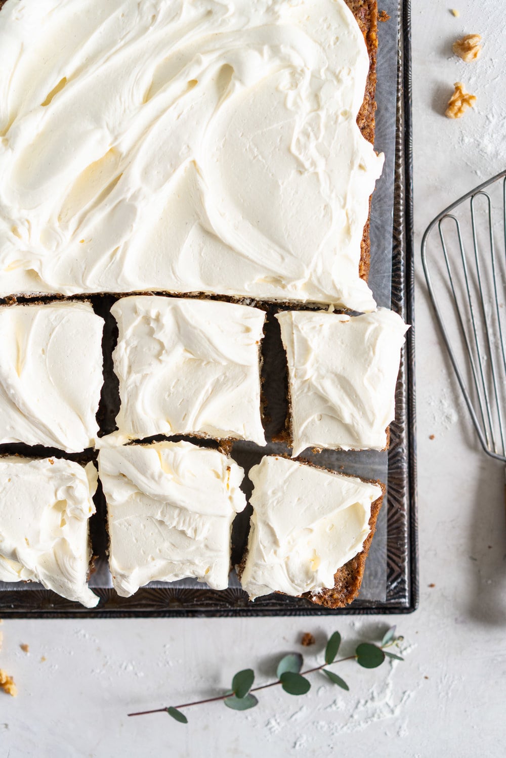 Brown Butter Carrot Sheet Cake is taken to the next level with a fluffy, whipped vanilla bean cream cheese german buttercream. This cake comes together super easily but is super delicious, and would make the perfect easter dessert. #brownbutter #carrotcake #sheetcake #germanbuttercream