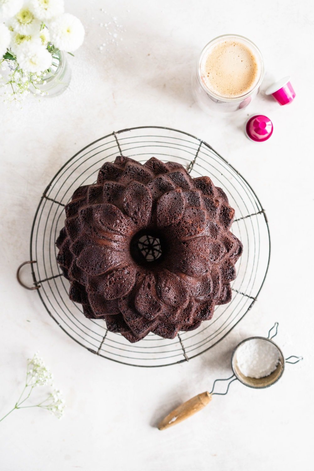 Nutella Chocolate Bundt Cake - this easy stir together bundt cake would be perfect for Mother's day or for any time that you need a sweet treat. It comes together super quickly, and is the perfect density thanks to the sour cream and nutella in the recipe. No mixer required - this one is a total crowd pleaser. #nutella #chocolatebundt #bundtcake