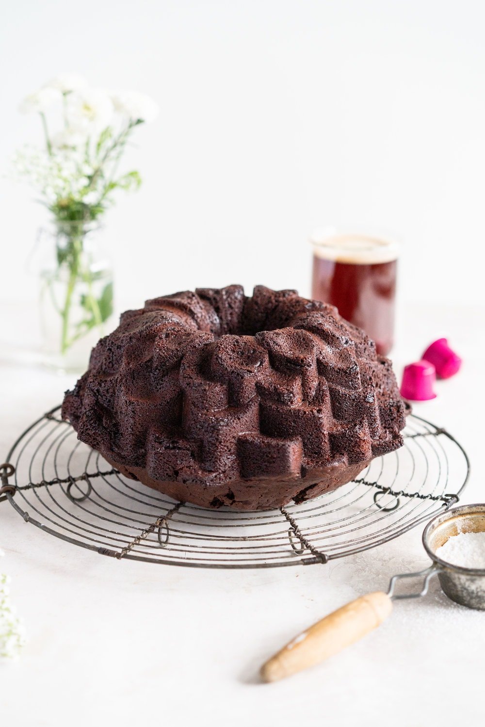Nutella Chocolate Bundt Cake - this easy stir together bundt cake would be perfect for Mother's day or for any time that you need a sweet treat. It comes together super quickly, and is the perfect density thanks to the sour cream and nutella in the recipe. No mixer required - this one is a total crowd pleaser. #nutella #chocolatebundt #bundtcake