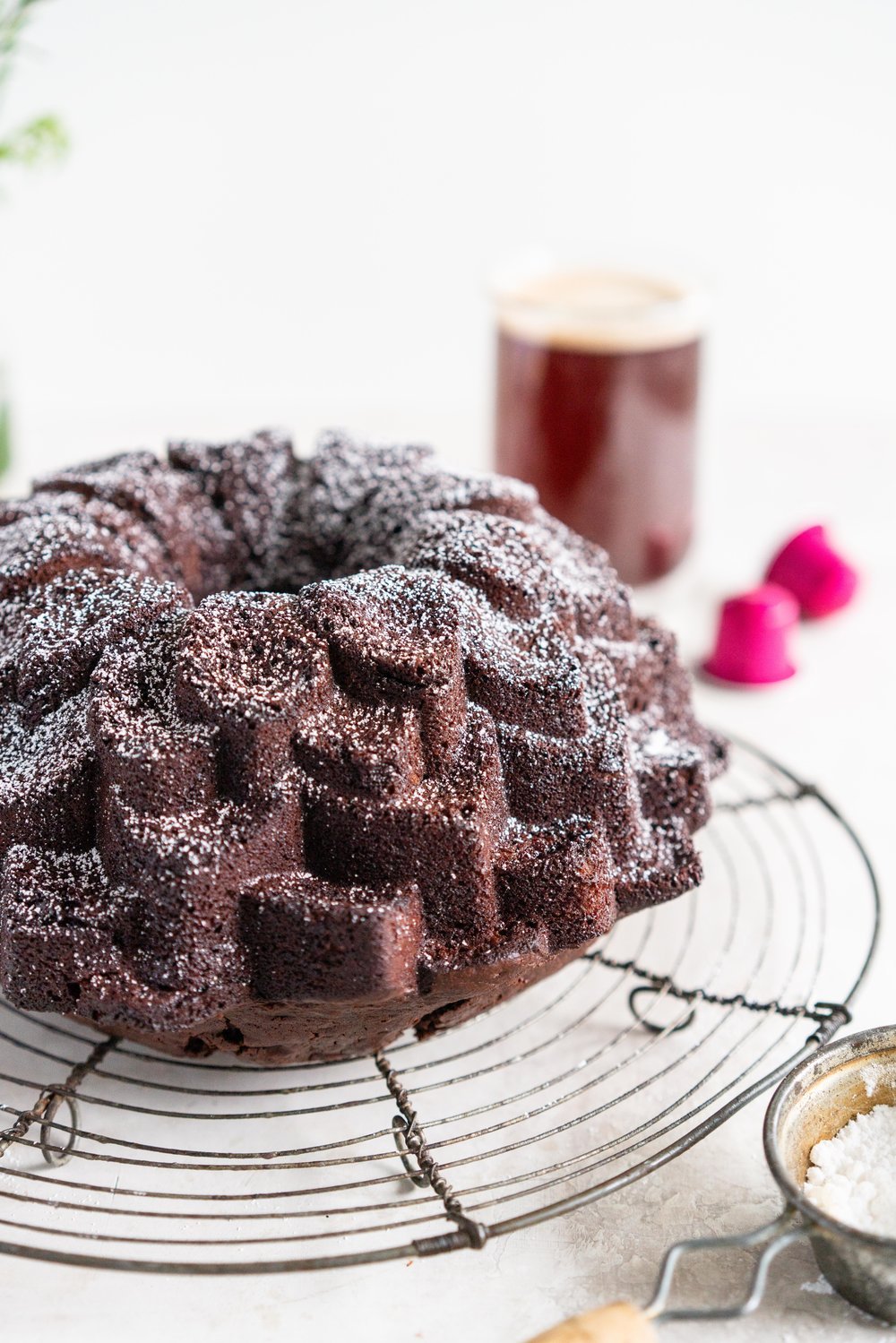 Nutella Chocolate Bundt Cake - this easy stir together bundt cake would be perfect for Mother's day or for any time that you need a sweet treat. It comes together super quickly, and is the perfect density thanks to the sour cream and nutella in the recipe. No mixer required - this one is a total crowd pleaser. #nutella #chocolatebundt #bundtcake