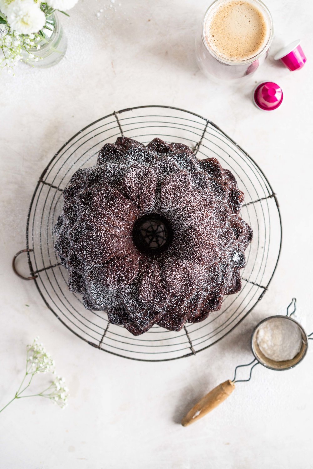 Nutella Chocolate Bundt Cake - this easy stir together bundt cake would be perfect for Mother's day or for any time that you need a sweet treat. It comes together super quickly, and is the perfect density thanks to the sour cream and nutella in the recipe. No mixer required - this one is a total crowd pleaser. #nutella #chocolatebundt #bundtcake