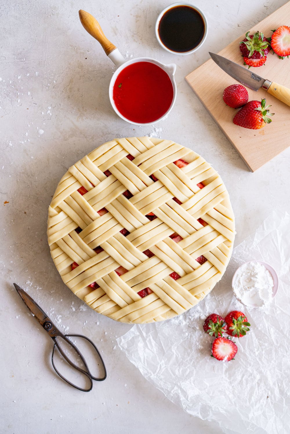 Strawberry Balsamic Pie - sweet strawberries are balanced out by Balsamic Vinegar, then wrapped up in a super flaky pie crust. Strawberry pie is the perfect summer dessert, is easy to make, and is ideal for taking along to an evening bbq or gathering. #strawberrypie #strawberrybalsamic #summerpie