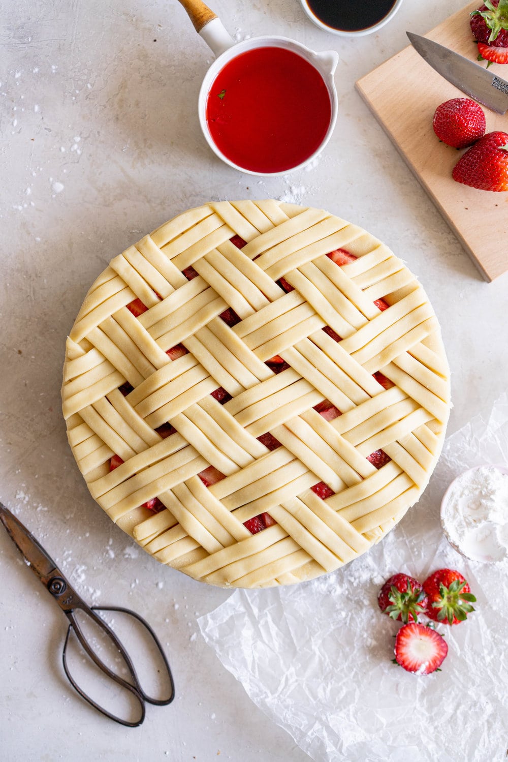 Strawberry Balsamic Pie - sweet strawberries are balanced out by Balsamic Vinegar, then wrapped up in a super flaky pie crust. Strawberry pie is the perfect summer dessert, is easy to make, and is ideal for taking along to an evening bbq or gathering. #strawberrypie #strawberrybalsamic #summerpie