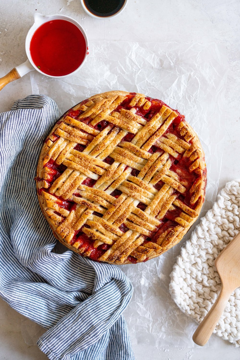 Strawberry Balsamic Pie - sweet strawberries are balanced out by Balsamic Vinegar, then wrapped up in a super flaky pie crust. Strawberry pie is the perfect summer dessert, is easy to make, and is ideal for taking along to an evening bbq or gathering. #strawberrypie #strawberrybalsamic #summerpie