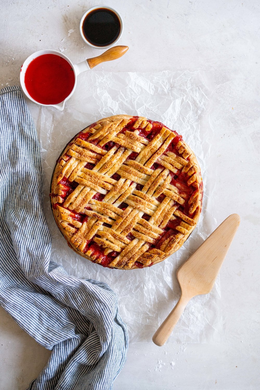 Strawberry Balsamic Pie - sweet strawberries are balanced out by Balsamic Vinegar, then wrapped up in a super flaky pie crust. Strawberry pie is the perfect summer dessert, is easy to make, and is ideal for taking along to an evening bbq or gathering. #strawberrypie #strawberrybalsamic #summerpie