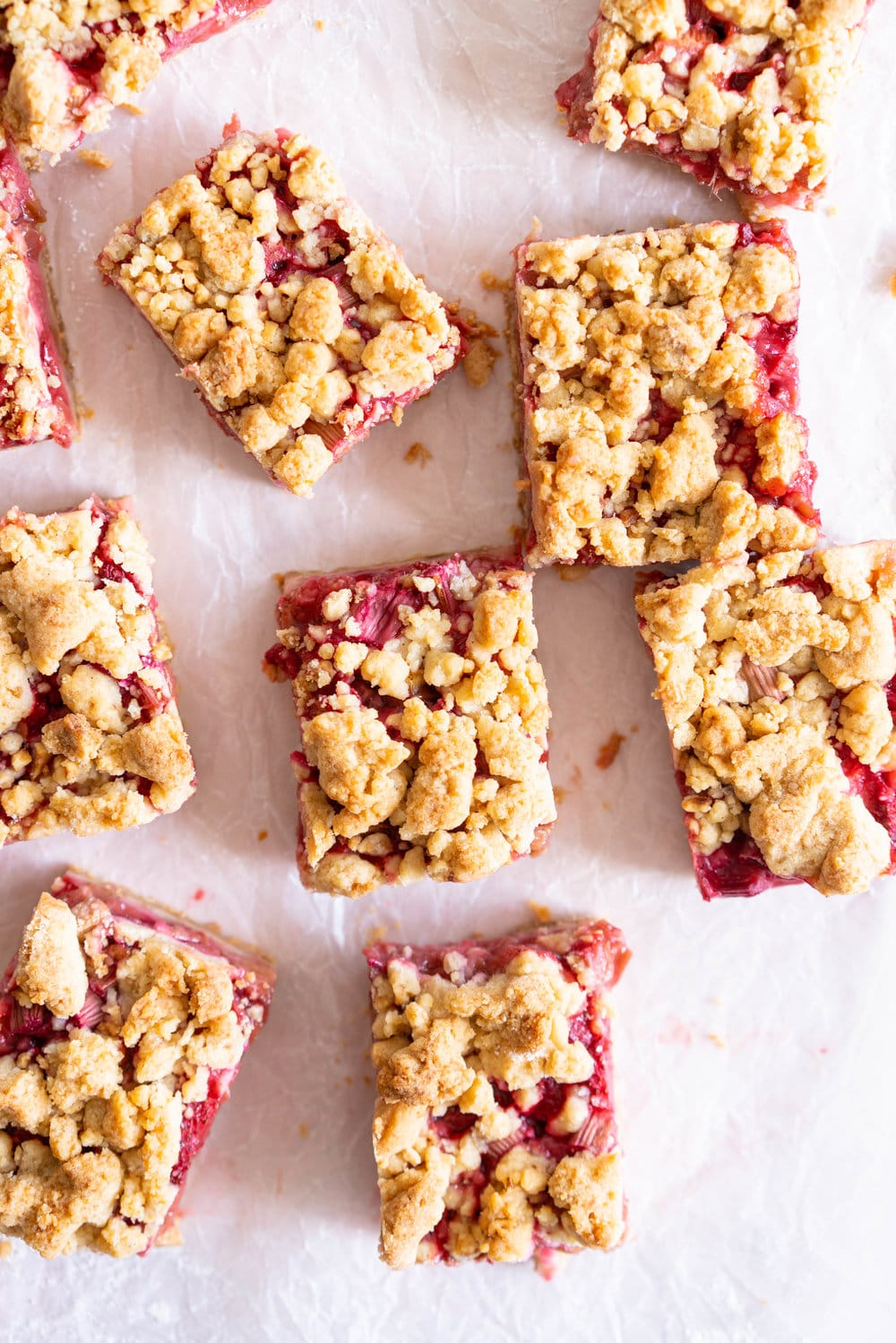 Brown Butter Hazelnut Strawberry Rhubarb Crumb Bars - a brown butter hazelnut shortbread is used as both the base and the crumble topping for these strawberry rhubarb crumb bars. These are the perfect early summer easy dessert! #crumbbars #strawberryrhubarb #brownbutter
