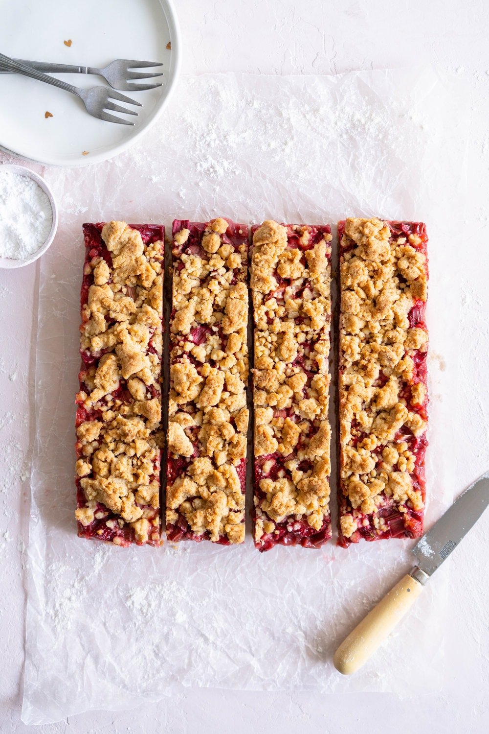 Brown Butter Hazelnut Strawberry Rhubarb Crumb Bars - a brown butter hazelnut shortbread is used as both the base and the crumble topping for these strawberry rhubarb crumb bars. These are the perfect early summer easy dessert! #crumbbars #strawberryrhubarb #brownbutter