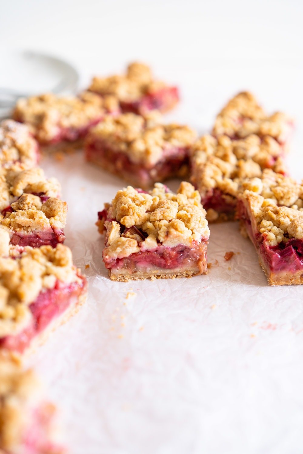Brown Butter Hazelnut Strawberry Rhubarb Crumb Bars - a brown butter hazelnut shortbread is used as both the base and the crumble topping for these strawberry rhubarb crumb bars. These are the perfect early summer easy dessert! #crumbbars #strawberryrhubarb #brownbutter