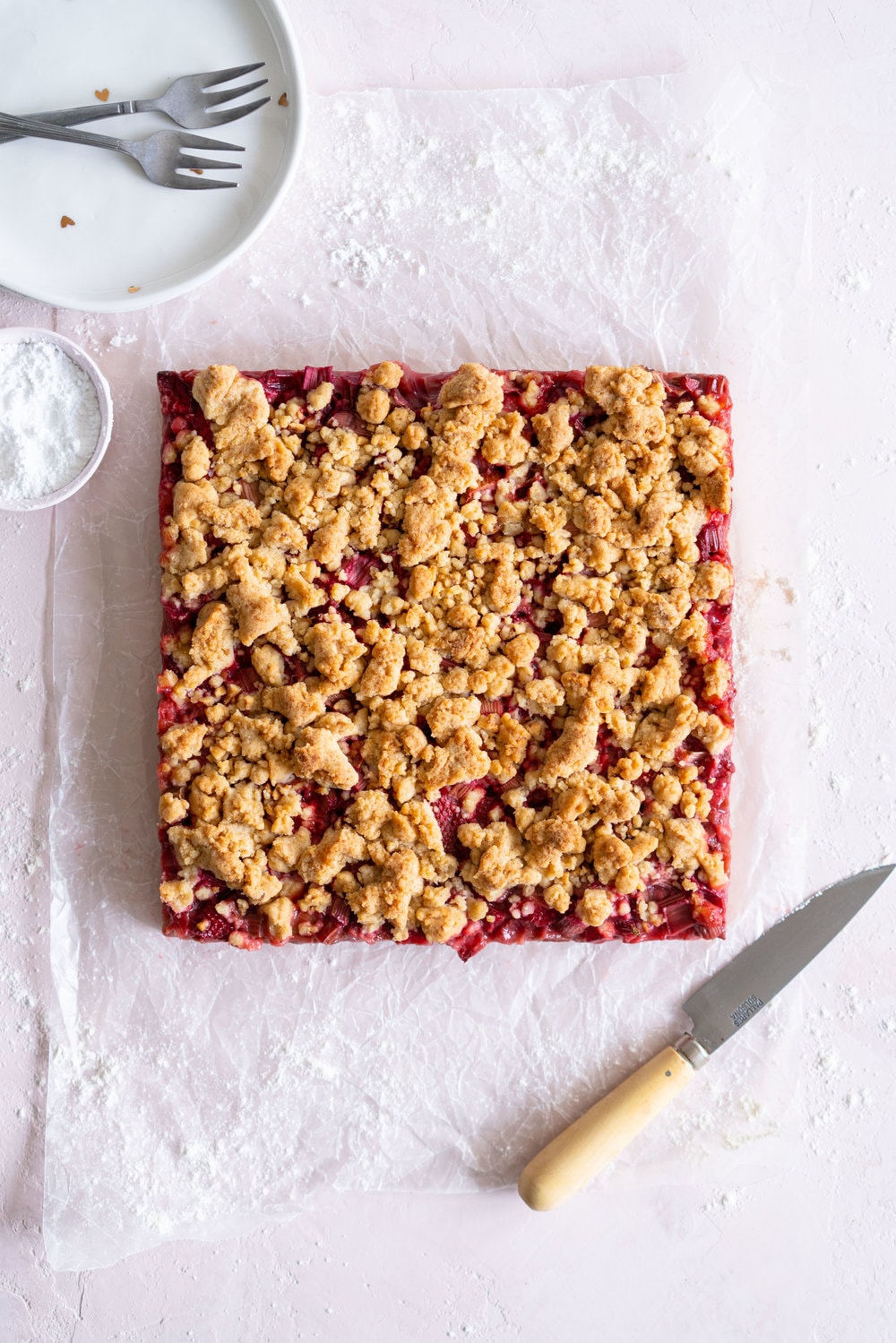 Brown Butter Hazelnut Strawberry Rhubarb Crumb Bars - a brown butter hazelnut shortbread is used as both the base and the crumble topping for these strawberry rhubarb crumb bars. These are the perfect early summer easy dessert! #crumbbars #strawberryrhubarb #brownbutter