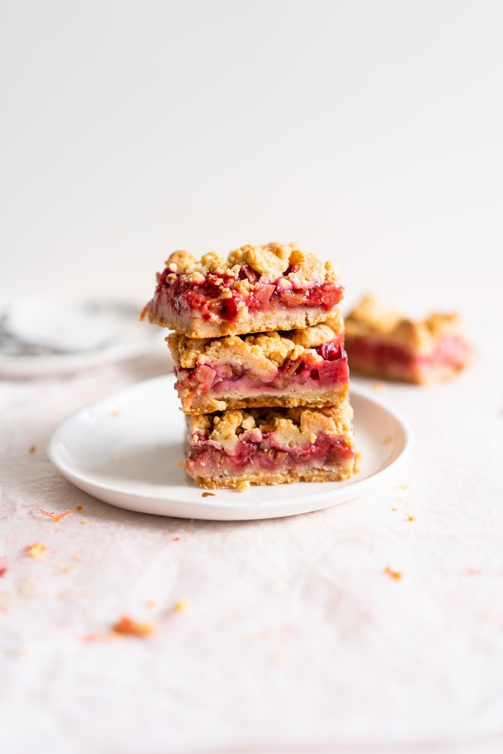 Brown Butter Hazelnut Strawberry Rhubarb Crumb Bars - a brown butter hazelnut shortbread is used as both the base and the crumble topping for these strawberry rhubarb crumb bars. These are the perfect early summer easy dessert! #crumbbars #strawberryrhubarb #brownbutter