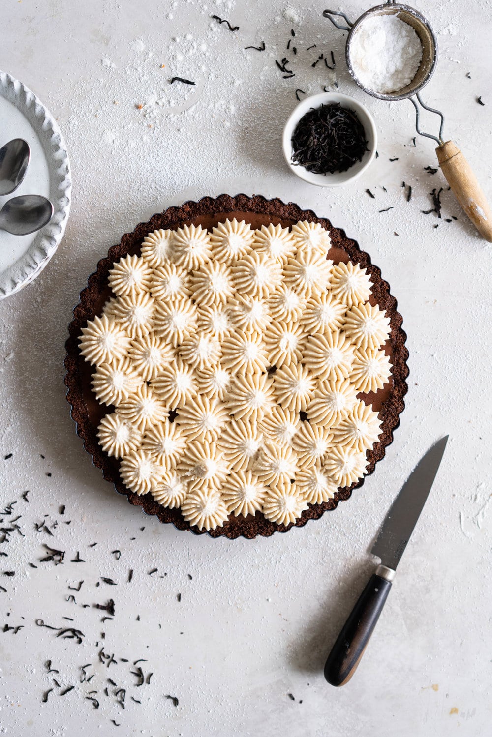 Dark Chocolate Salted Caramel Ganache Tart with Chocolate Graham Cracker Crust and Earl Grey Mascarpone Whipped Cream - this chocolate tart comes together quickly, and is the perfect easy dessert that easily feeds a crowd. A crunch base is topped with a silky smooth chocolate salted caramel filling, and finished with an earl grey mascarpone whipped cream. #chocolatetart #saltedcaramel #earlgreywhippedcream