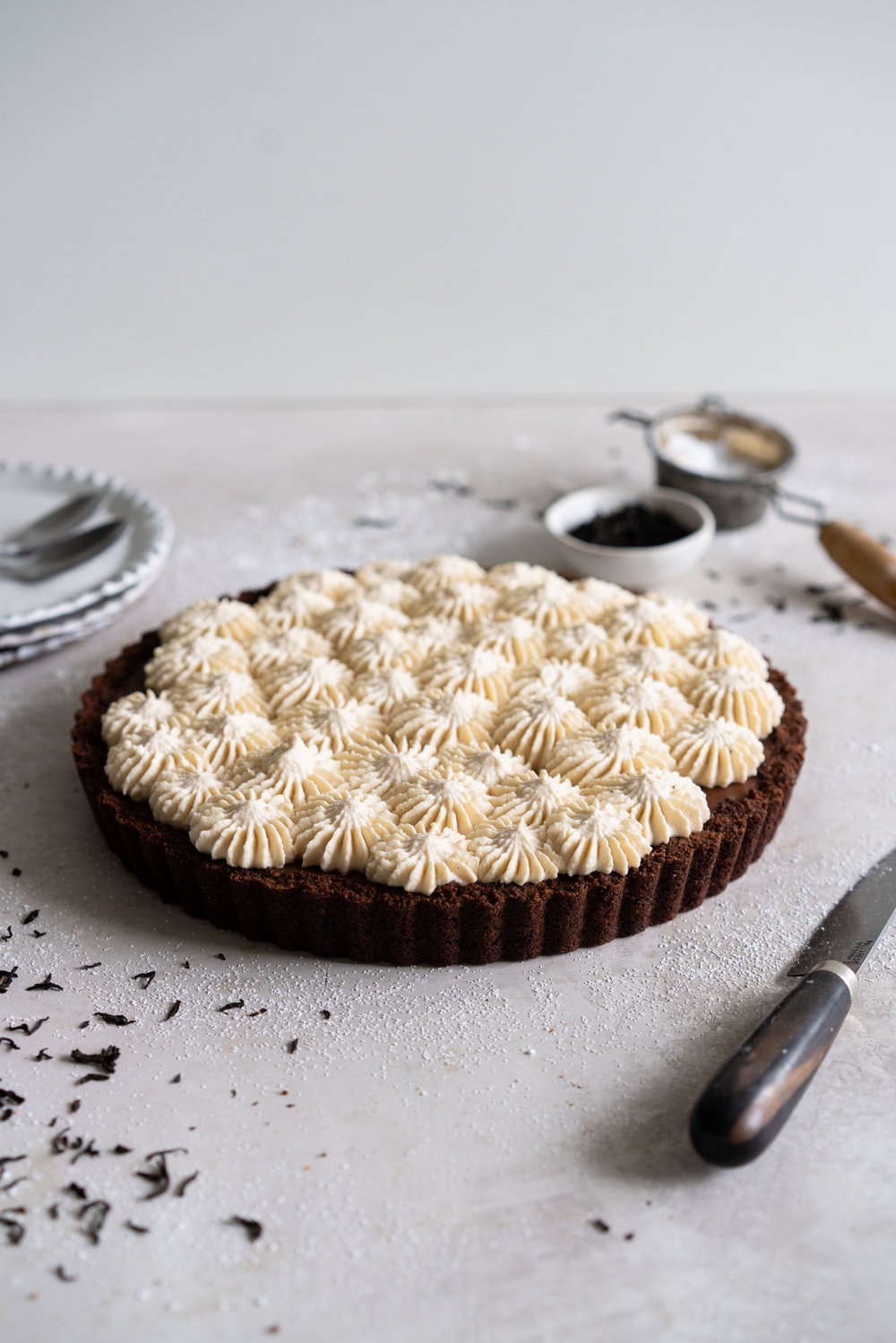 Dark Chocolate Salted Caramel Ganache Tart with Chocolate Graham Cracker Crust and Earl Grey Mascarpone Whipped Cream - this chocolate tart comes together quickly, and is the perfect easy dessert that easily feeds a crowd. A crunch base is topped with a silky smooth chocolate salted caramel filling, and finished with an earl grey mascarpone whipped cream. #chocolatetart #saltedcaramel #earlgreywhippedcream