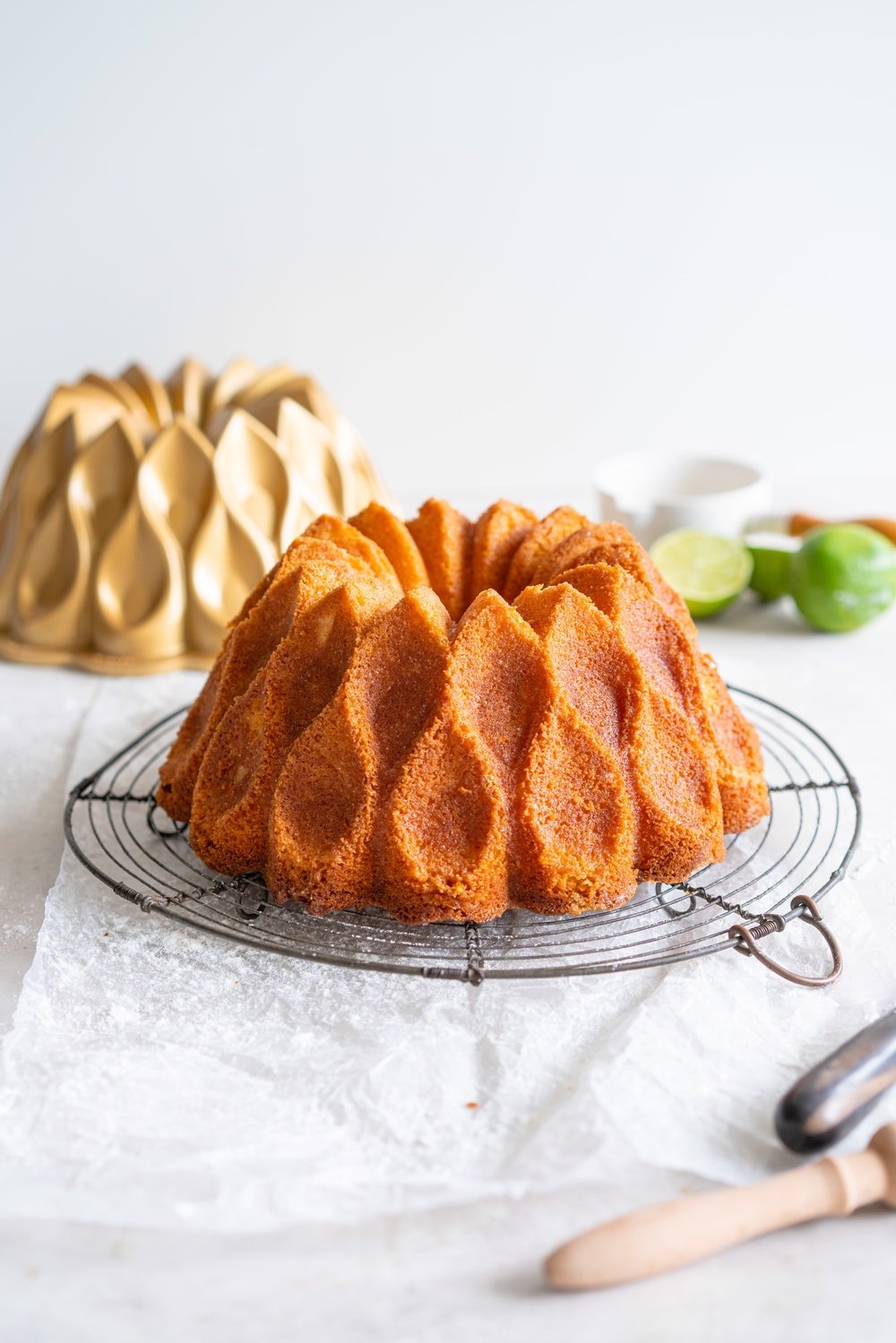 Maida Heatter's East 62nd Street Lemon Cake (Lemon and Lime Bundt Cake). This recipe comes from the legendary Maida Heatter's latest book, Happiness is baking. It is a tender crumbed lemon cake, brushed with a crunchy sugary glaze. Incredibly easy and so, so delicious. #maidaheatter #lemoncake #bundtcake
