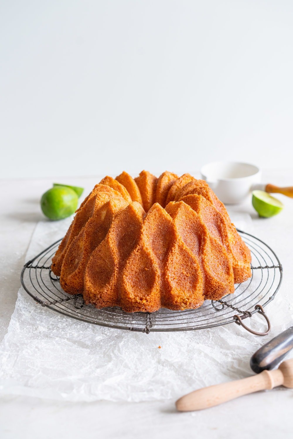 Maida Heatter's East 62nd Street Lemon Cake (Lemon and Lime Bundt Cake). This recipe comes from the legendary Maida Heatter's latest book, Happiness is baking. It is a tender crumbed lemon cake, brushed with a crunchy sugary glaze. Incredibly easy and so, so delicious. #maidaheatter #lemoncake #bundtcake