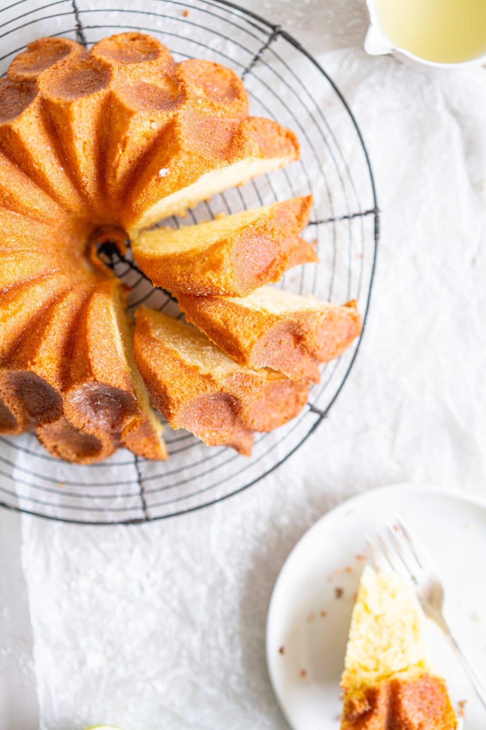 Maida Heatter's East 62nd Street Lemon Cake (Lemon and Lime Bundt Cake). This recipe comes from the legendary Maida Heatter's latest book, Happiness is baking. It is a tender crumbed lemon cake, brushed with a crunchy sugary glaze. Incredibly easy and so, so delicious. #maidaheatter #lemoncake #bundtcake