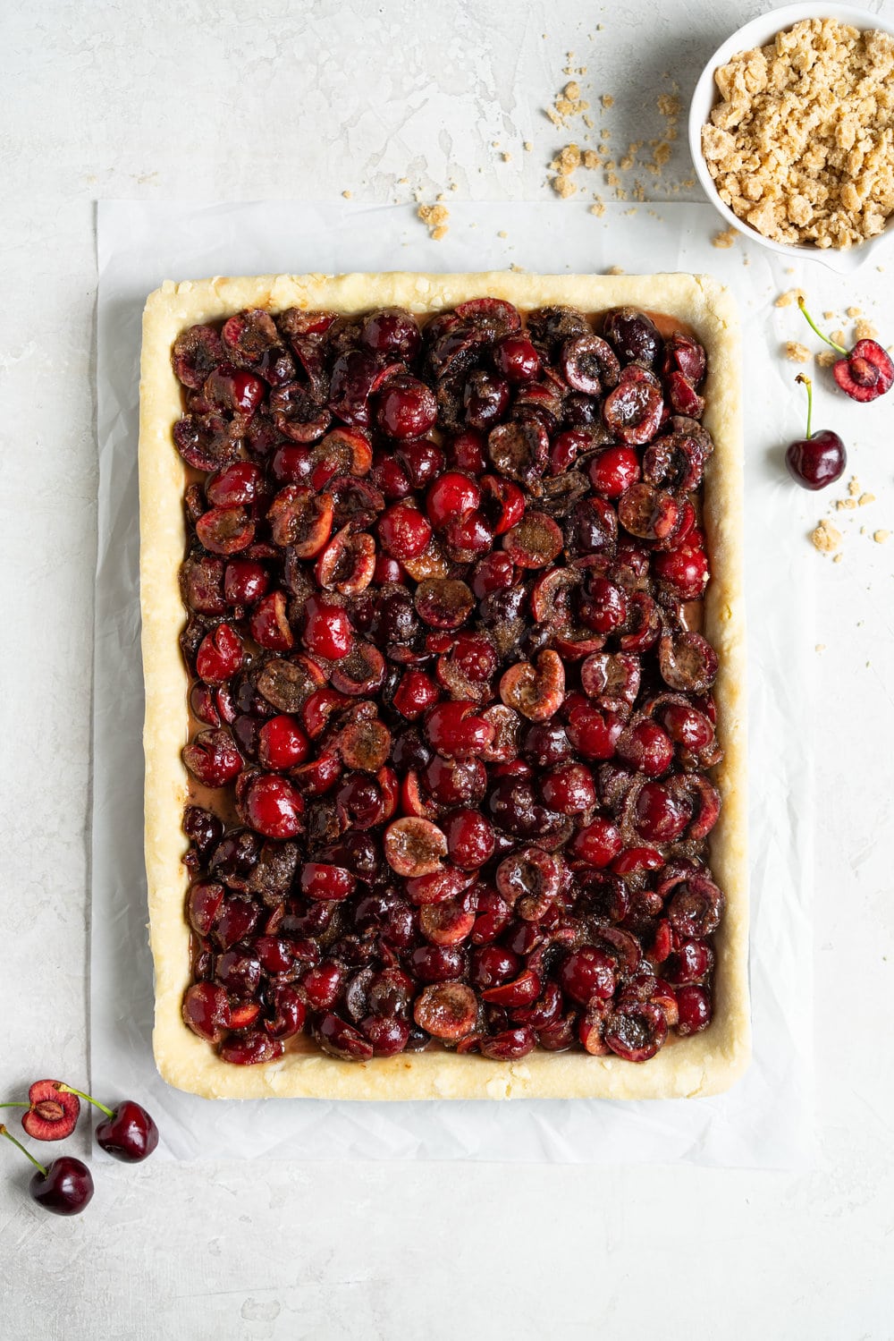 Cherry Slab Pie with Brown Butter Oat Streusel - a thick cherry slab pie is topped with a layer of flaky pastry and finished with a brown butter oat streusel that gives the most perfect crunch. #slabpie #streusel #cherrypie #cherryslabpie