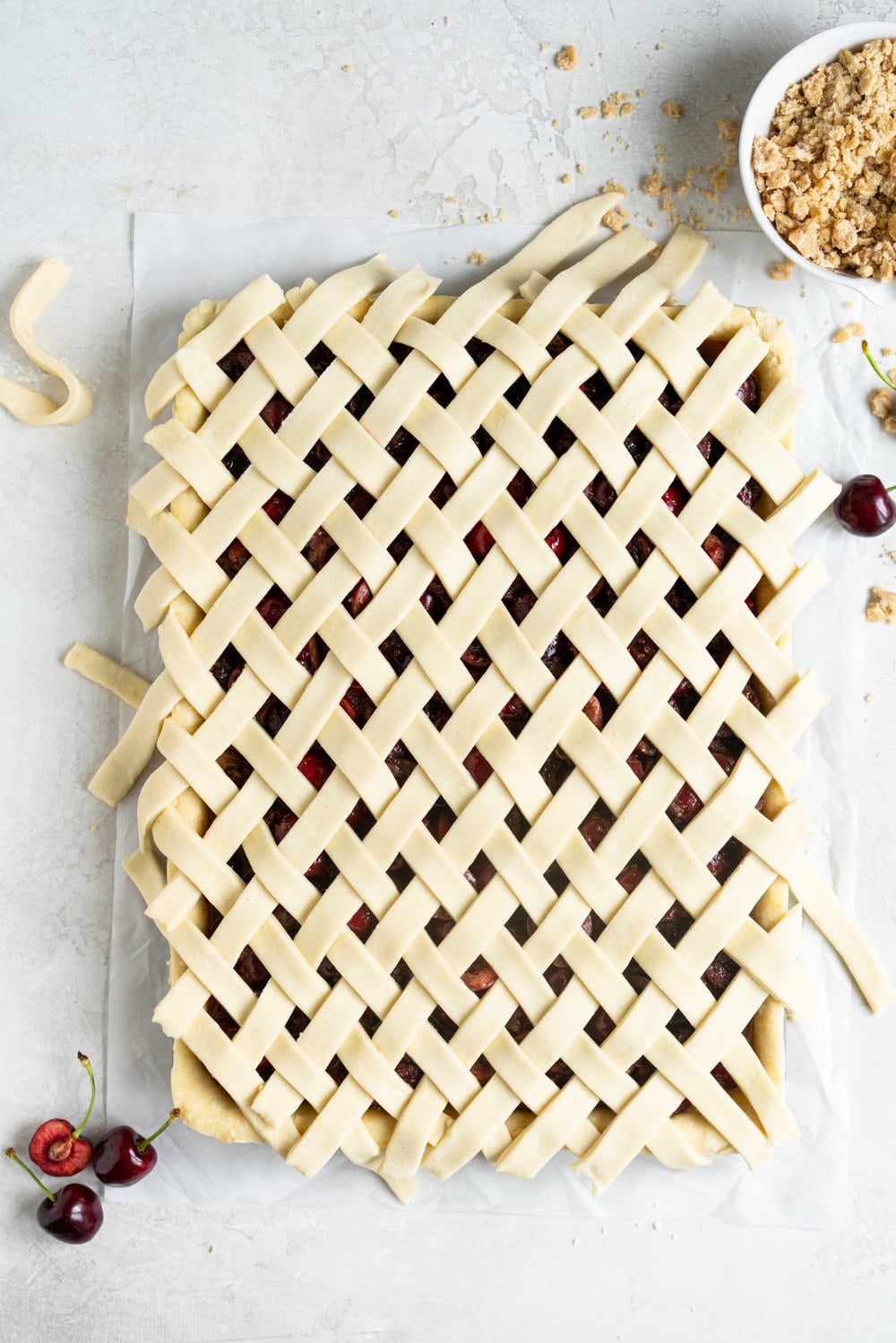 Cherry Slab Pie with Brown Butter Oat Streusel - a thick cherry slab pie is topped with a layer of flaky pastry and finished with a brown butter oat streusel that gives the most perfect crunch. #slabpie #streusel #cherrypie #cherryslabpie