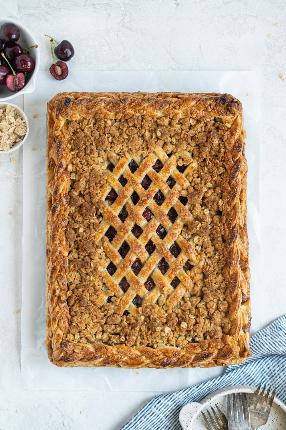 Cherry Slab Pie with Brown Butter Oat Streusel - a thick cherry slab pie is topped with a layer of flaky pastry and finished with a brown butter oat streusel that gives the most perfect crunch. #slabpie #streusel #cherrypie #cherryslabpie