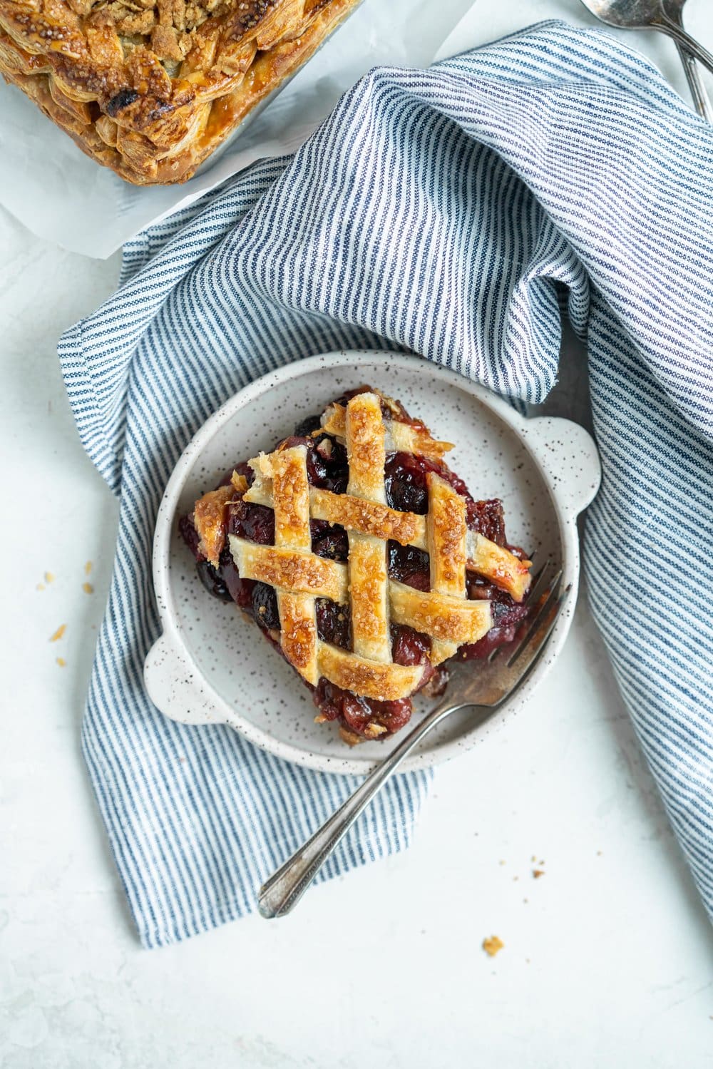 Cherry Slab Pie with Brown Butter Oat Streusel - a thick cherry slab pie is topped with a layer of flaky pastry and finished with a brown butter oat streusel that gives the most perfect crunch. #slabpie #streusel #cherrypie #cherryslabpie