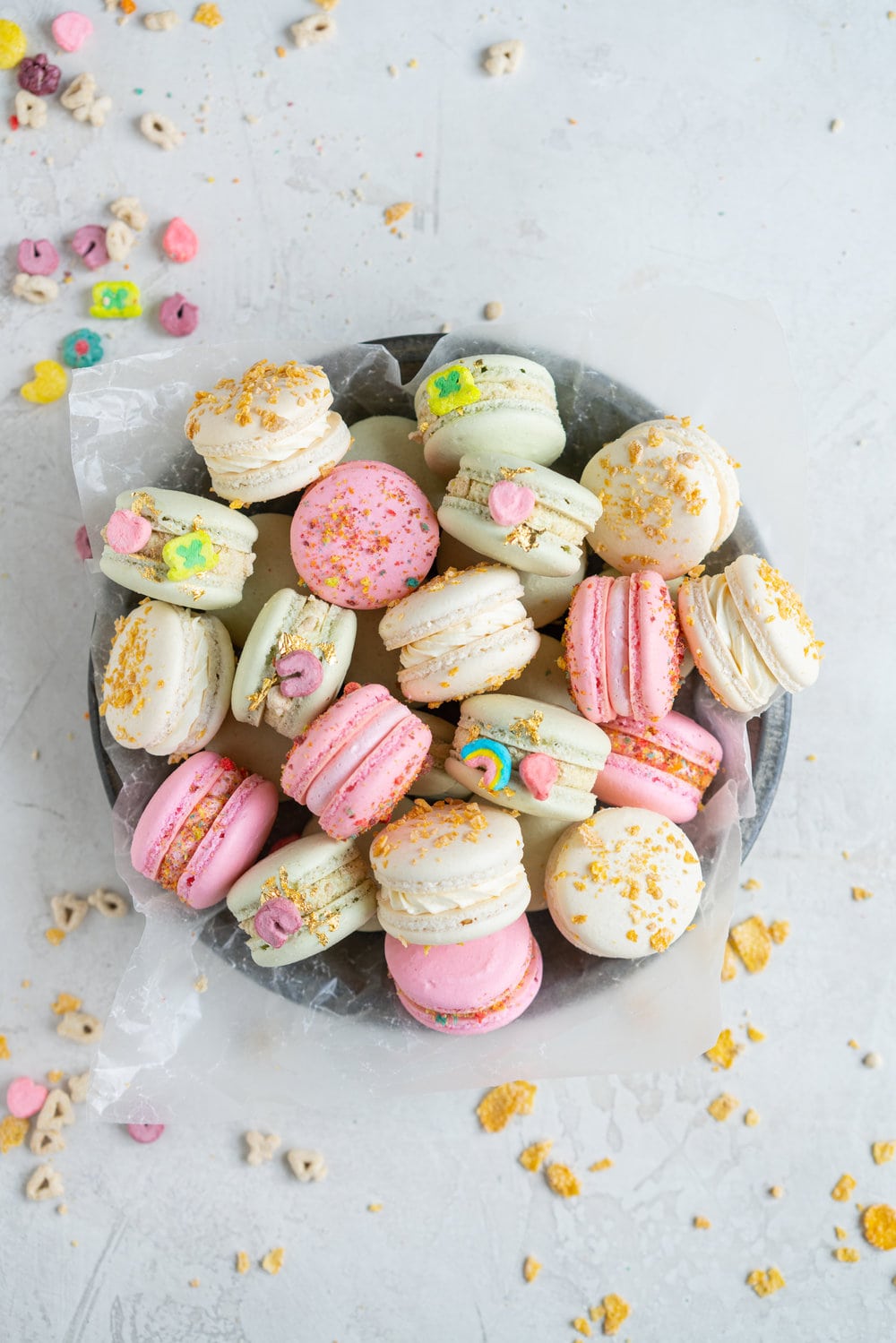 French Macarons with Cereal Milk German Buttercream. These Easy French Macarons are filled with a cereal infused german buttercream. They are an elevated version of your favourite childhood cereal. Frosted Flakes, Lucky Charms, Trix. #frenchmacarons #easymacarons #macaronrecipe