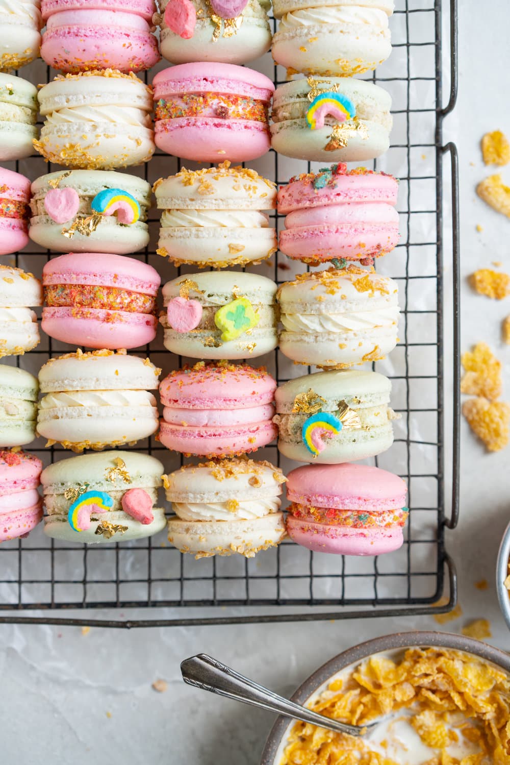 French Macarons with Cereal Milk German Buttercream. These Easy French Macarons are filled with a cereal infused german buttercream. They are an elevated version of your favourite childhood cereal. Frosted Flakes, Lucky Charms, Trix. #frenchmacarons #easymacarons #macaronrecipe