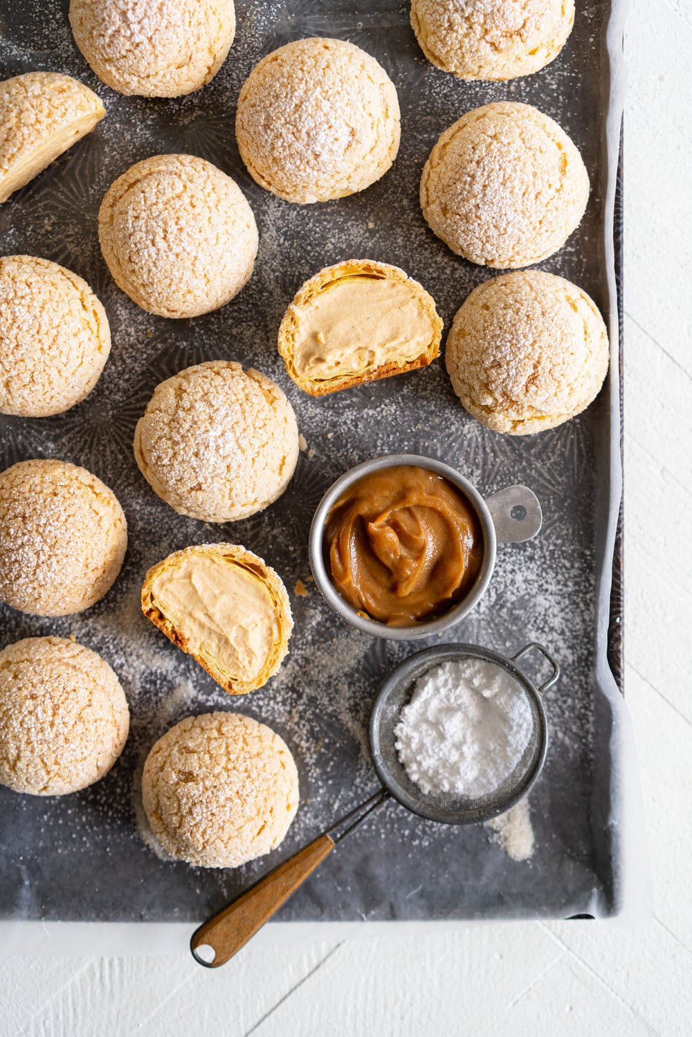 Golden Sugar Choux au Craquelin - Cream Puffs with Salted Caramel Diplomat Cream. These easy cream puffs, topped with crispy craquelin, are stuffed full with a salted caramel pastry cream, which is folded into softly whipped cream to form salted caramel diplomat cream. #creampuffs #chouxaucraquelin #saltedcaramel #diplomatcream