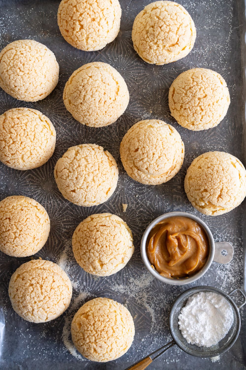 Golden Sugar Choux au Craquelin - Cream Puffs with Salted Caramel Diplomat Cream. These easy cream puffs, topped with crispy craquelin, are stuffed full with a salted caramel pastry cream, which is folded into softly whipped cream to form salted caramel diplomat cream. #creampuffs #chouxaucraquelin #saltedcaramel #diplomatcream