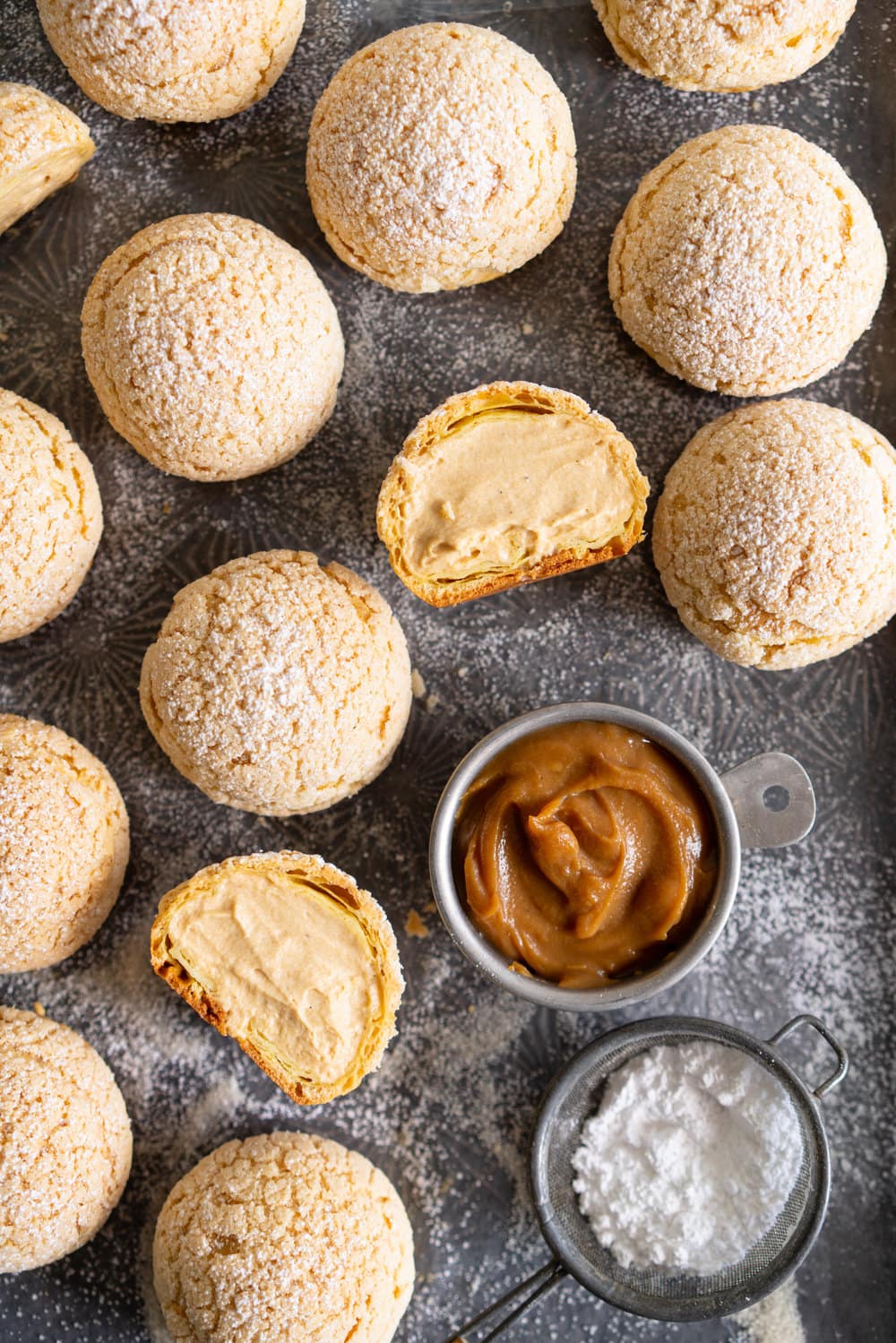 Golden Sugar Choux au Craquelin - Cream Puffs with Salted Caramel Diplomat Cream. These easy cream puffs, topped with crispy craquelin, are stuffed full with a salted caramel pastry cream, which is folded into softly whipped cream to form salted caramel diplomat cream. #creampuffs #chouxaucraquelin #saltedcaramel #diplomatcream