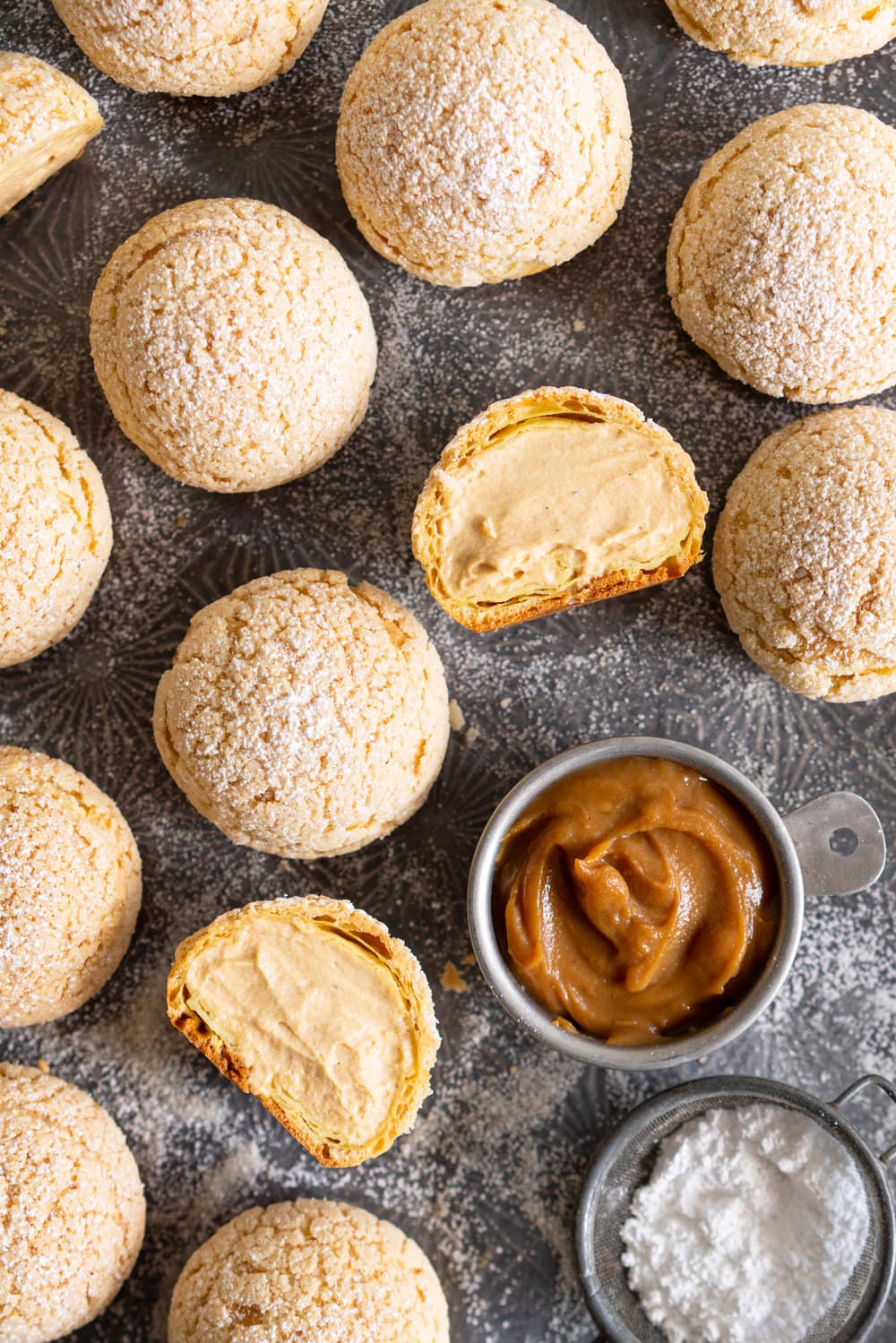 Golden Sugar Choux au Craquelin - Cream Puffs with Salted Caramel Diplomat Cream. These easy cream puffs, topped with crispy craquelin, are stuffed full with a salted caramel pastry cream, which is folded into softly whipped cream to form salted caramel diplomat cream. #creampuffs #chouxaucraquelin #saltedcaramel #diplomatcream