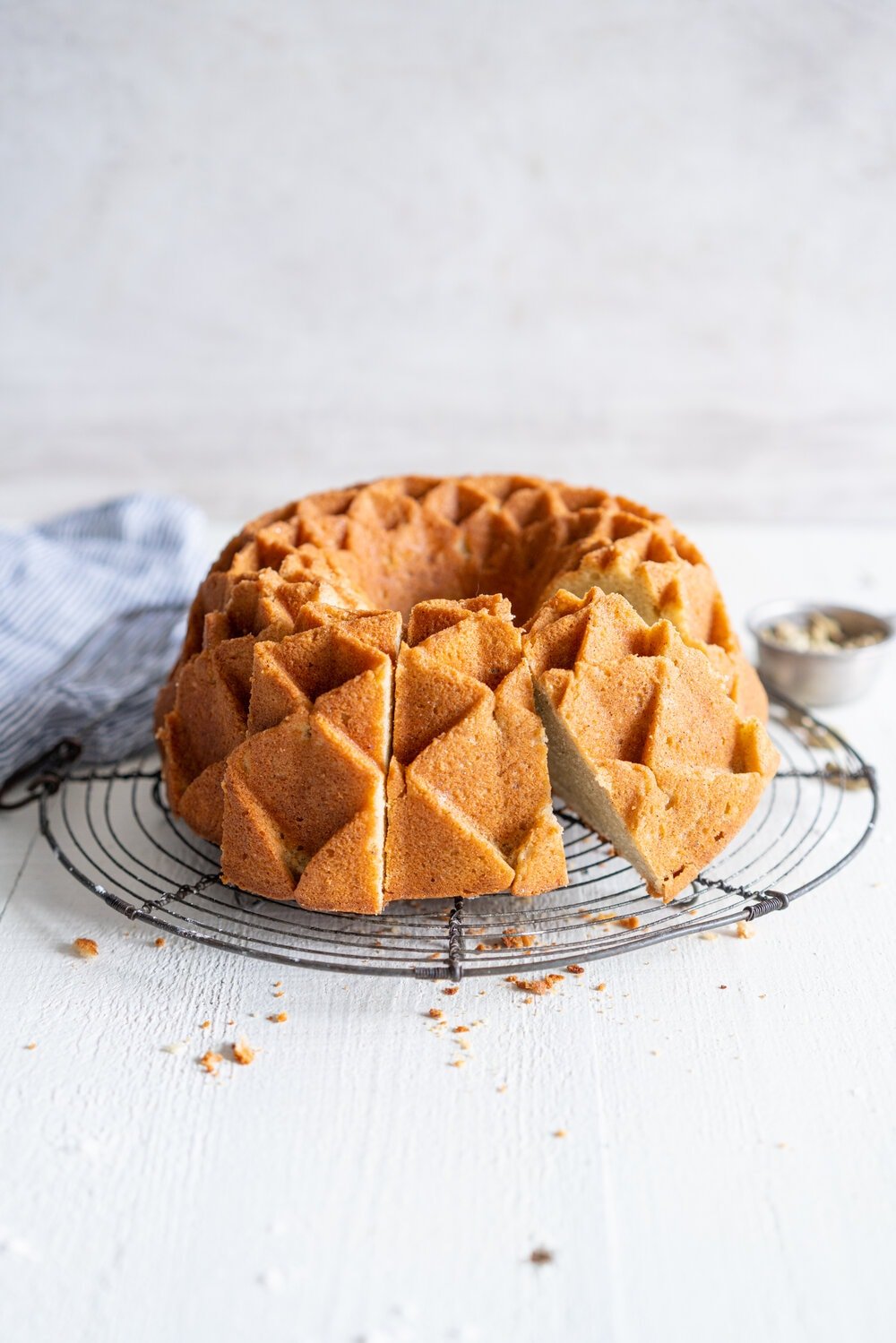 Cardamom Bundt Cake with Cardamom Syrup glaze - this super versatile cardamom sour cream cake is full of warming cardamom spices, both from within the cake and from the simple cardamom bundt syrup glaze that is brushed on top. You can leave the cardamom out for a perfect vanilla sour cream bundt cake, or leave it in there for a cozy, warming bundt cake. #bundtcake #bundtrecipe #cardamombuntcake