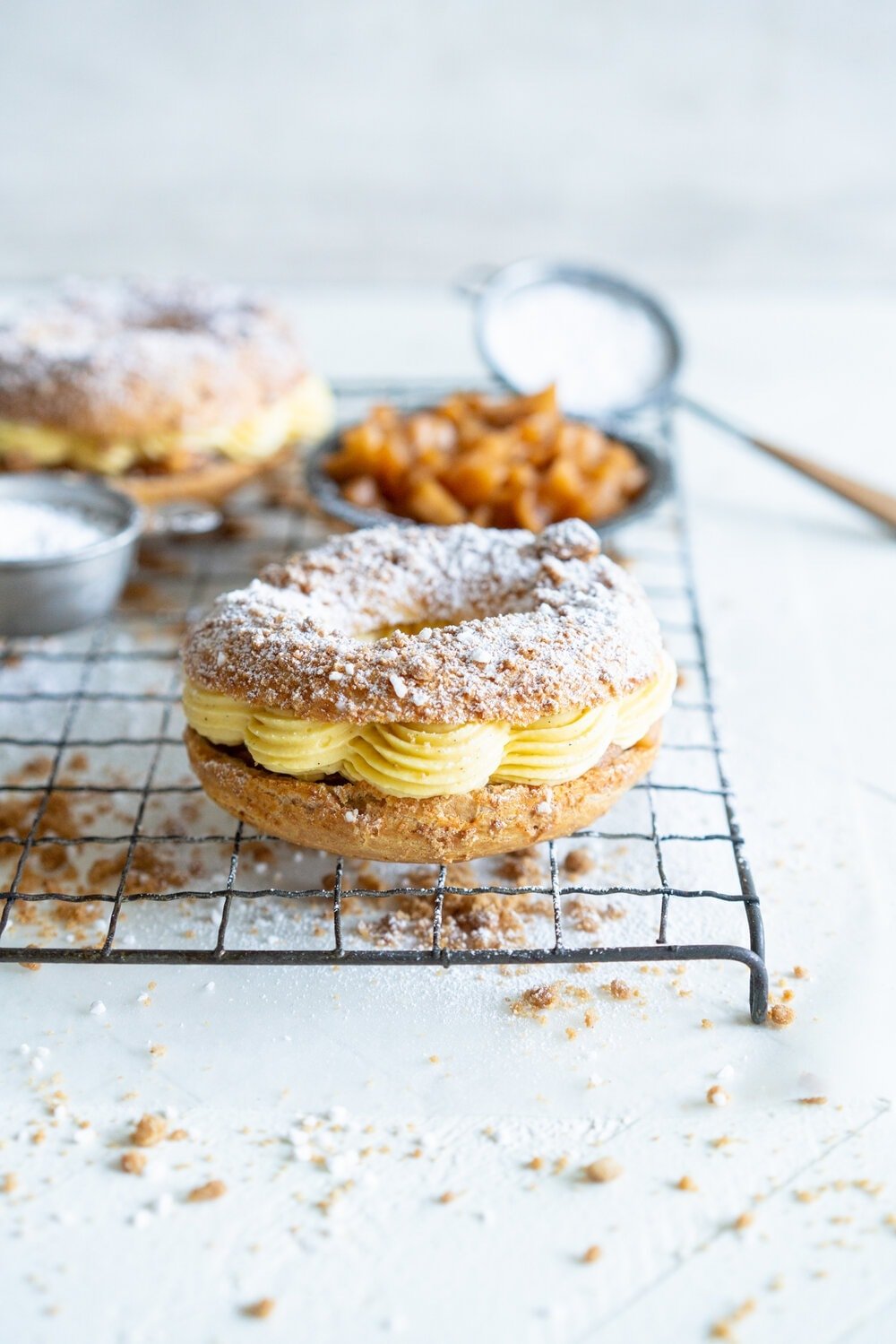 Paris Brest with Brown Butter Streusel, Custard Mousseline Cream and Spiced Apples. Paris Brest is a round baked choux ring, traditionally filled with a praline mousseline. I have riffed on that slightly, filling it with a custard mousseline, and spiced apples for a seasonal take on a french patisserie classic. #parisbrest #mousseline #custard #spicedapples
