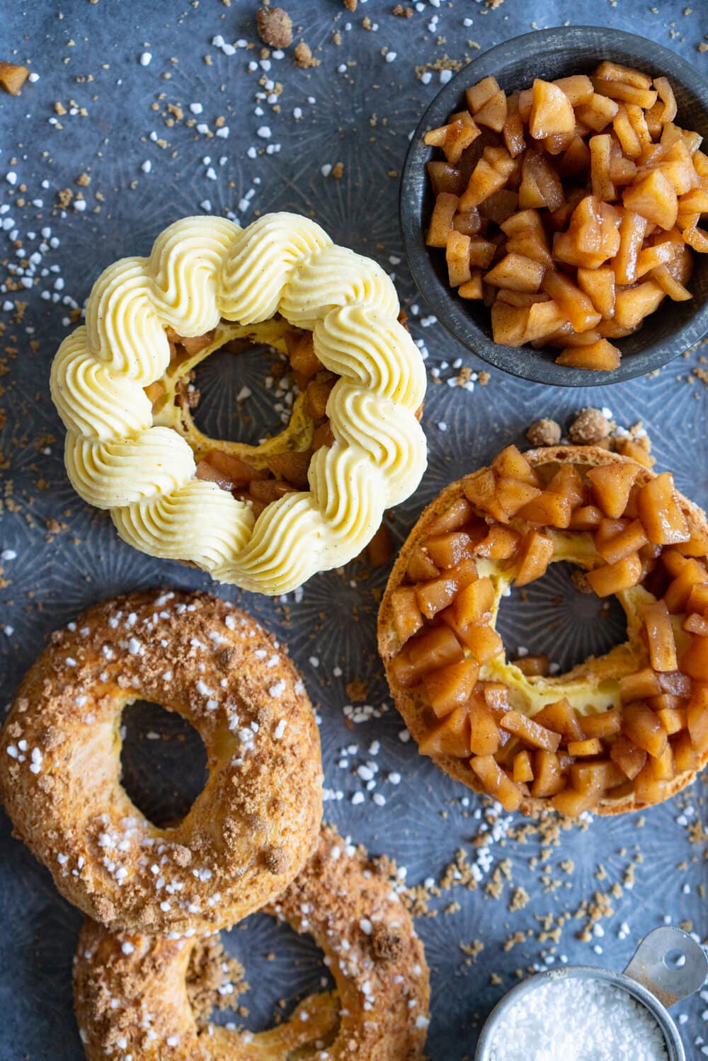 Paris Brest with Brown Butter Streusel, Custard Mousseline Cream and Spiced Apples. Paris Brest is a round baked choux ring, traditionally filled with a praline mousseline. I have riffed on that slightly, filling it with a custard mousseline, and spiced apples for a seasonal take on a french patisserie classic. #parisbrest #mousseline #custard #spicedapples