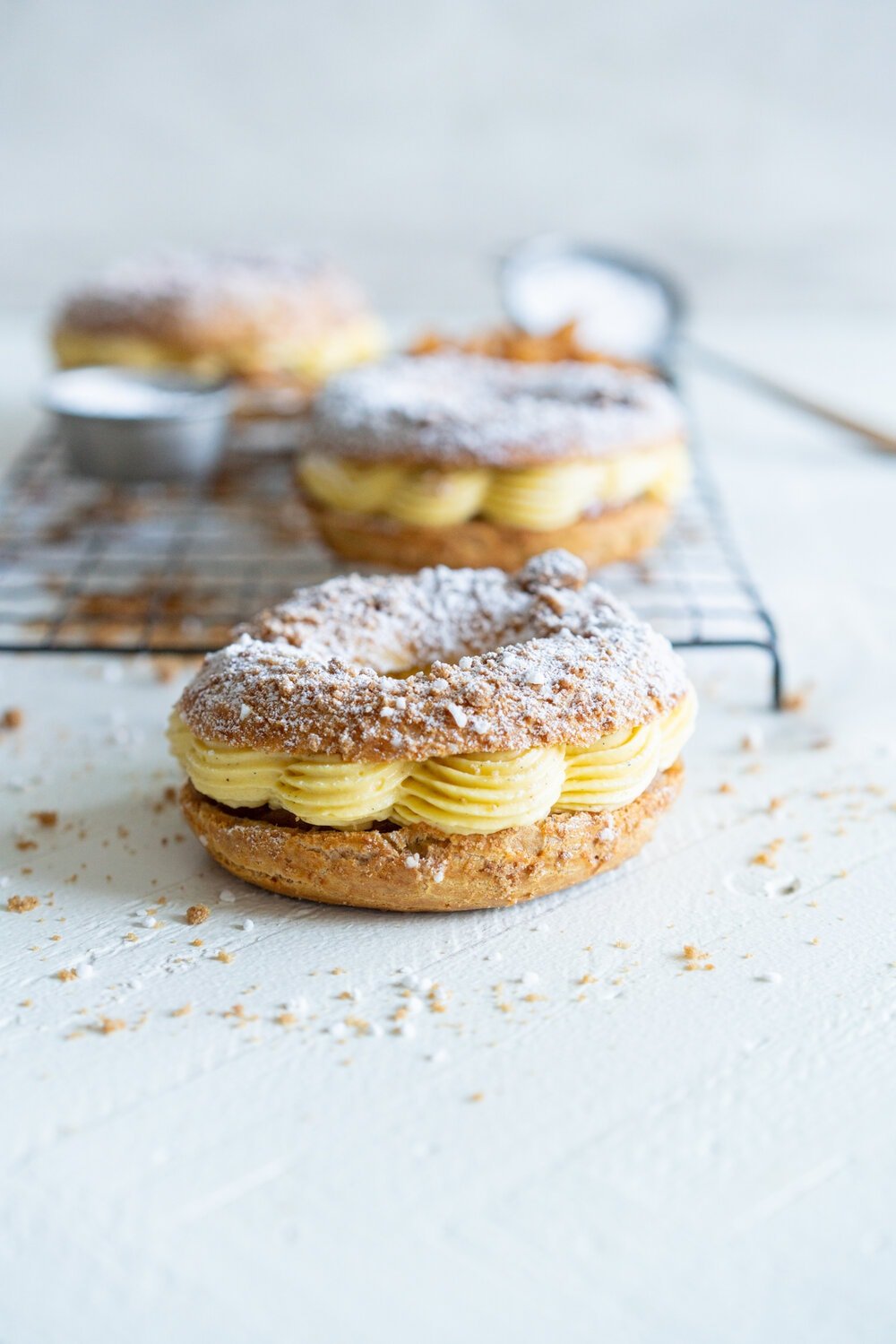 Paris Brest with Brown Butter Streusel, Custard Mousseline Cream and Spiced Apples. Paris Brest is a round baked choux ring, traditionally filled with a praline mousseline. I have riffed on that slightly, filling it with a custard mousseline, and spiced apples for a seasonal take on a french patisserie classic. #parisbrest #mousseline #custard #spicedapples