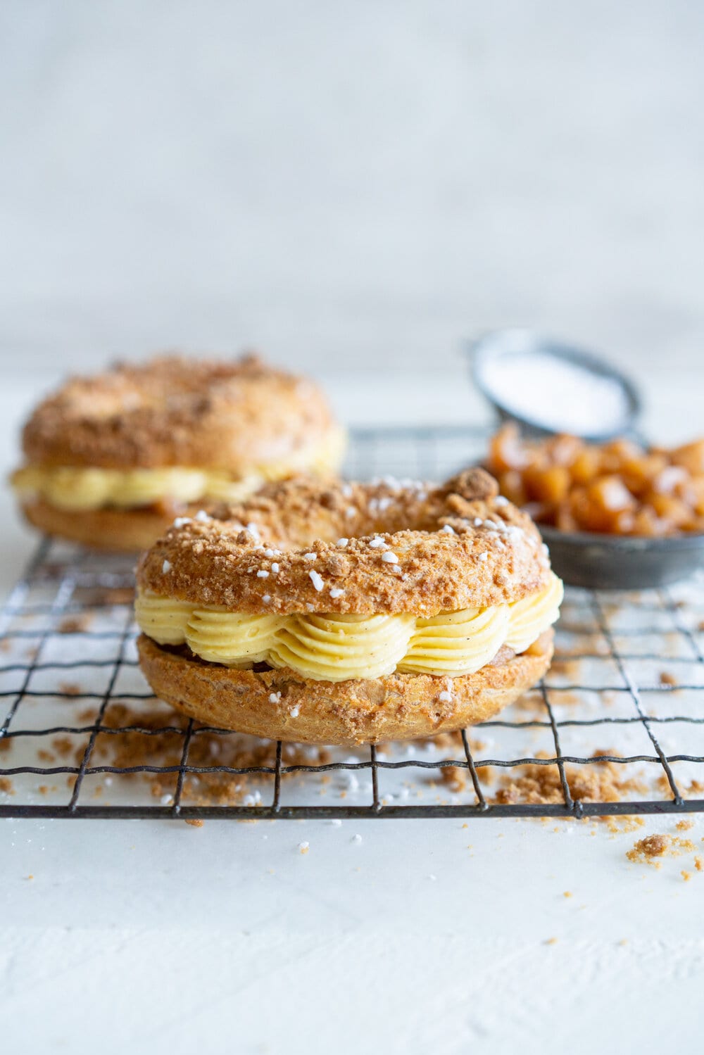 Paris Brest with Brown Butter Streusel, Custard Mousseline Cream and Spiced Apples. Paris Brest is a round baked choux ring, traditionally filled with a praline mousseline. I have riffed on that slightly, filling it with a custard mousseline, and spiced apples for a seasonal take on a french patisserie classic. #parisbrest #mousseline #custard #spicedapples
