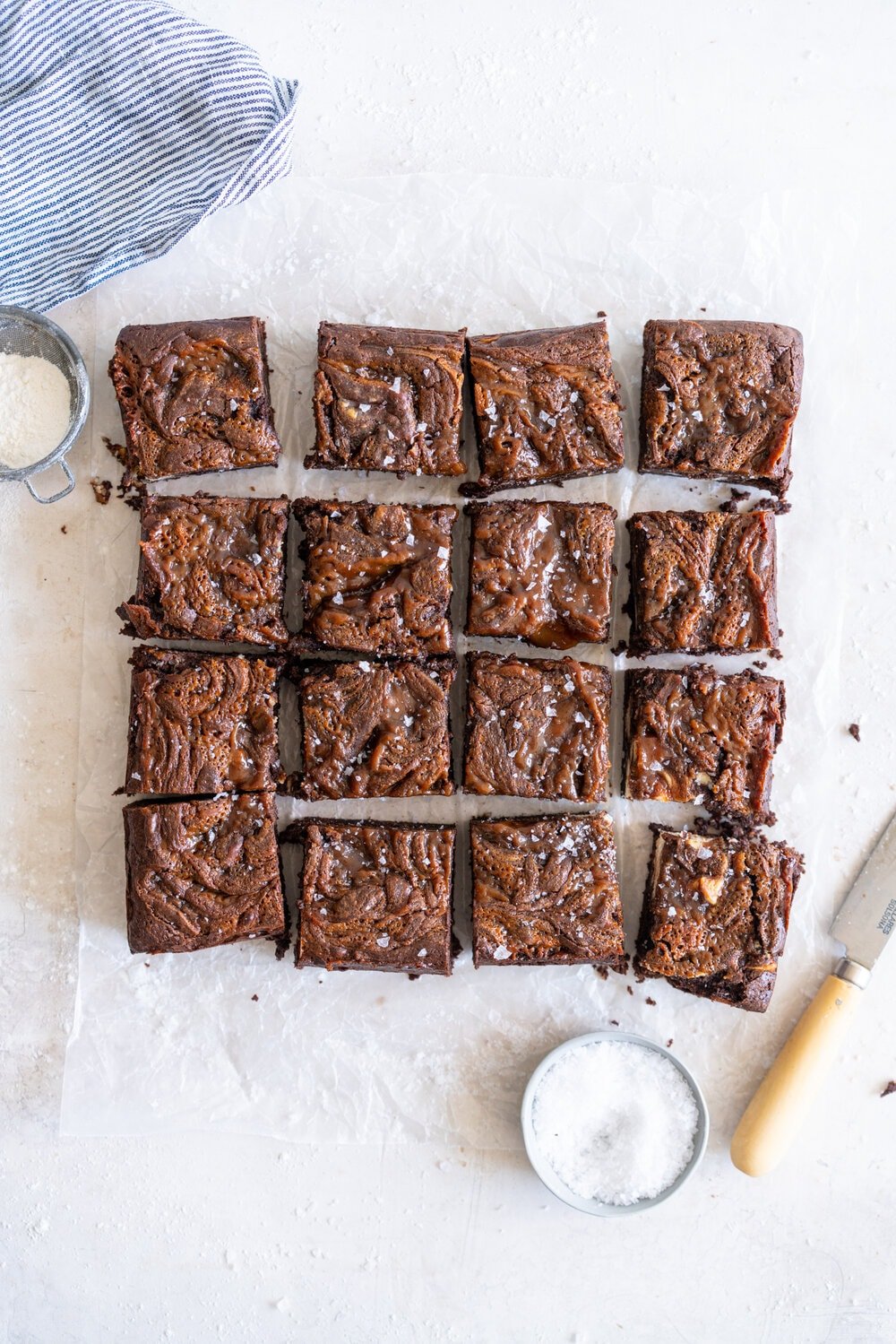Peanut Butter Caramel Cream Cheese Swirl Brownies - fudgy brownies are swirled with a cheesecake cream cheese layer and then topped with a peanut butter caramel before being baked until fudgy and perfect. These are a must for any cheesecake or peanut butter lovers. #peanutbutterbrownies #creamcheesebrownies #cheesecakebrownies