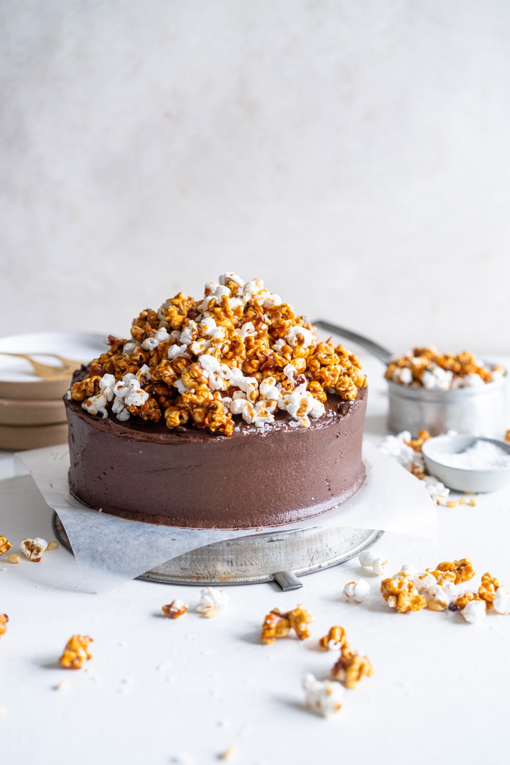 Chocolate Buttermilk Cake with Chocolate Cream Cheese Frosting and Honey Caramel Corn. A one bowl chocolate cake is finished with a chocolate cream cheese icing and topped with honey caramel corn. This cake is easy to make, only takes one bowl, and is perfectly moist from the addition of the buttermilk. It comes from Charlotte Ree's new book, 'Just Desserts'  #chocolatecake #chocolatebuttermilkcake #caramelcorn