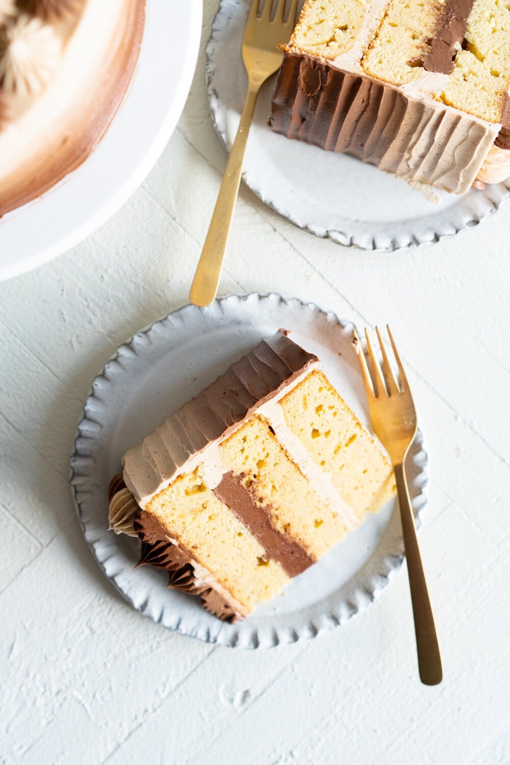 Apple Cider Layer Cake with Spiced Caramel Swiss Meringue Buttercream. This layer cake has reduced apple cider added to the batter, giving it a delicate apple flavour. It is finished with spiced salted caramel swiss meringue buttercream with an ombre finish.  #applecidercake #caramelbuttercream #swissmeringue