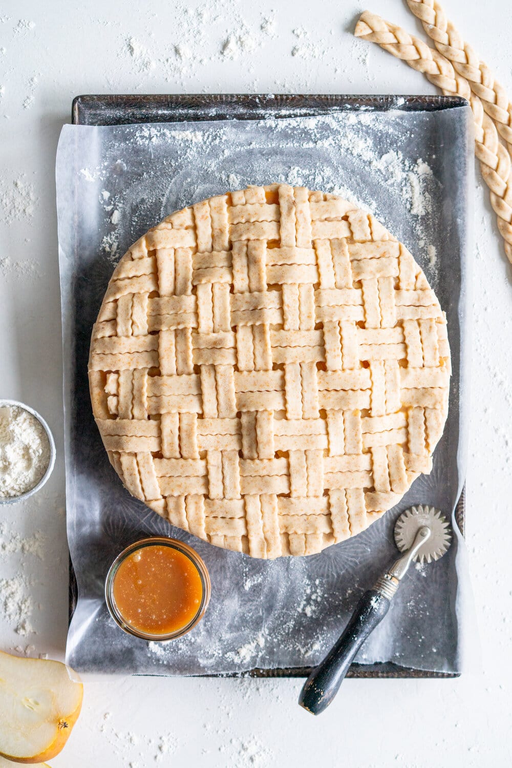 Pear Pie with Ginger Caramel and Spelt Crust - fresh pears are tucked into a pie with a fresh ginger caramel and a nutty spelt pie crust. This is the perfect easy alternative to a caramel apple pie, and the addition of spelt to the pie crust ramps up the flavour. #pearpie #pearcaramelpie #spelt