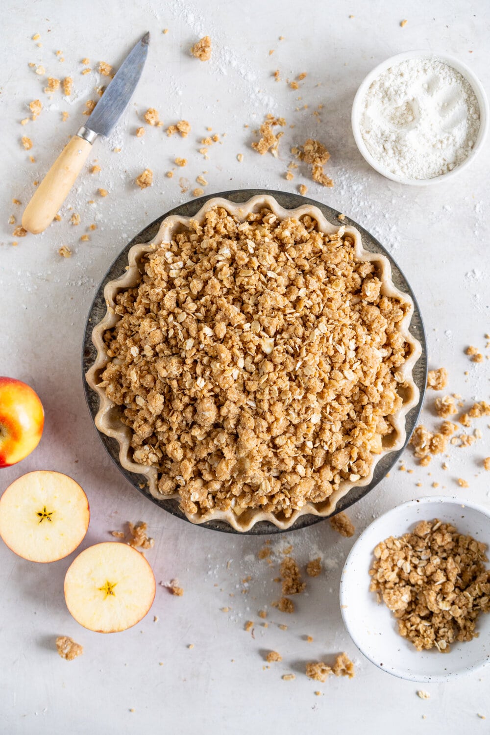 Apple Crumble Pie with Rye Crust - a toasty rye pie crust is filled with apple filling and topped with an oaty crumble that is baked until perfectly golden. A combination of two of the best apple desserts - apple pie and apple crumble. A delicious twist on the classic apple pie. #applecrumble #applecrumblepie #applecrumbpie