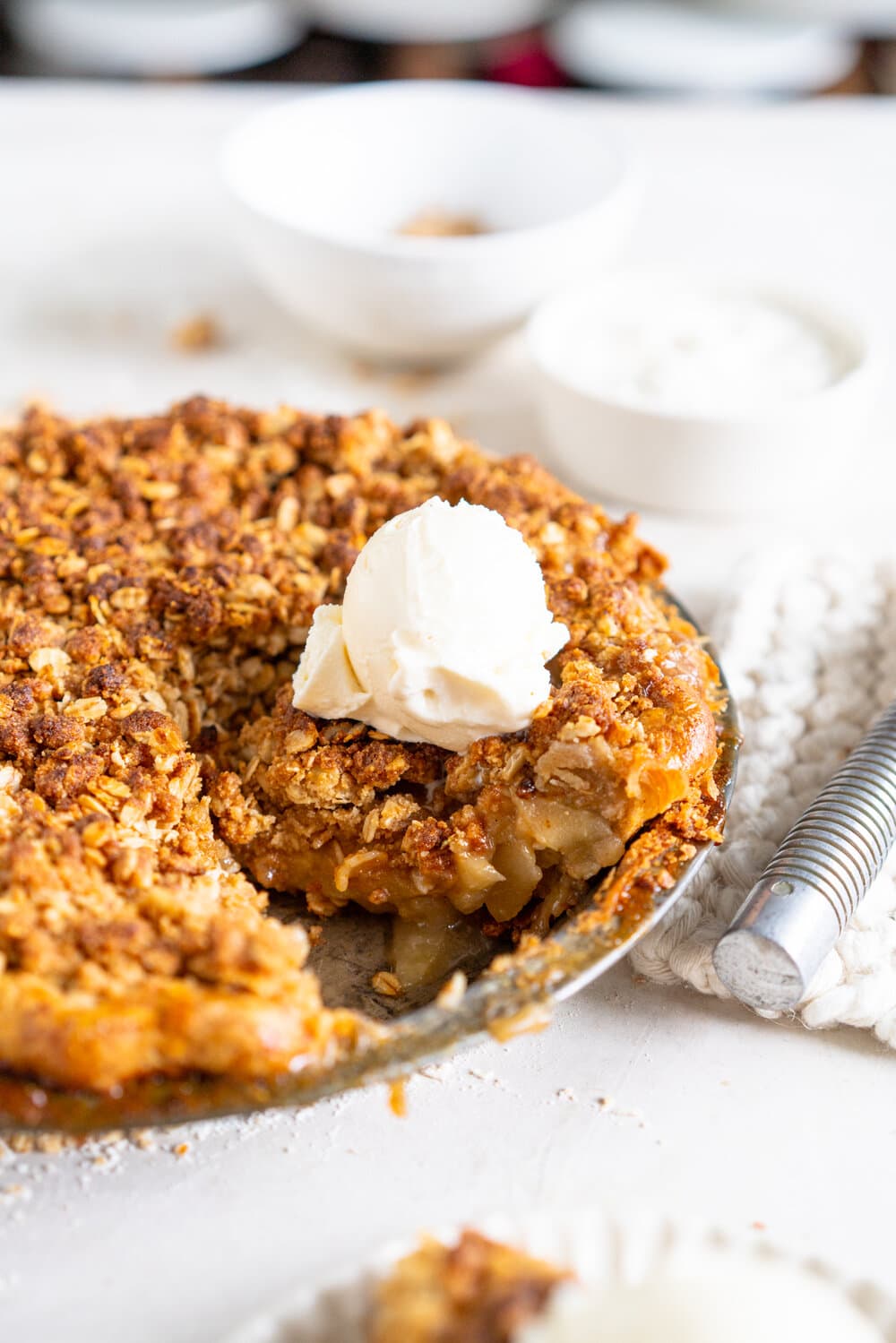 Apple Crumble Pie with Rye Crust - a toasty rye pie crust is filled with apple filling and topped with an oaty crumble that is baked until perfectly golden. A combination of two of the best apple desserts - apple pie and apple crumble. A delicious twist on the classic apple pie. #applecrumble #applecrumblepie #applecrumbpie