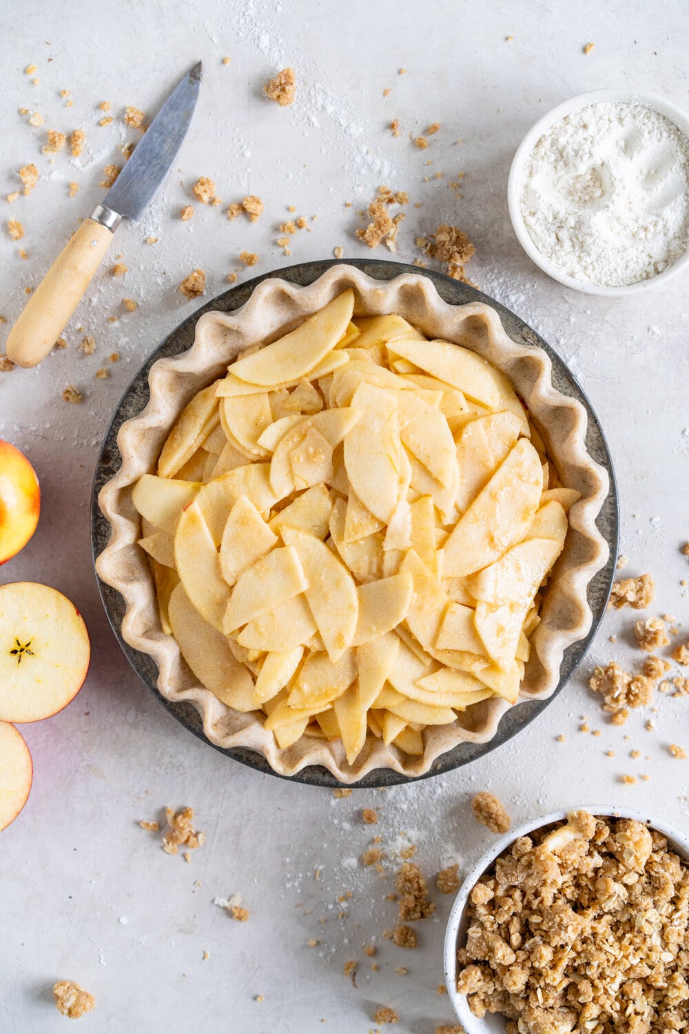 Apple Crumble Pie with Rye Crust - a toasty rye pie crust is filled with apple filling and topped with an oaty crumble that is baked until perfectly golden. A combination of two of the best apple desserts - apple pie and apple crumble. A delicious twist on the classic apple pie. #applecrumble #applecrumblepie #applecrumbpie