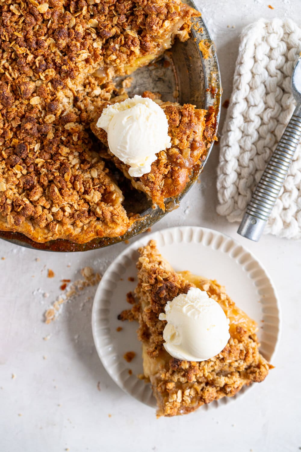 Apple Crumble Pie with Rye Crust - a toasty rye pie crust is filled with apple filling and topped with an oaty crumble that is baked until perfectly golden. A combination of two of the best apple desserts - apple pie and apple crumble. A delicious twist on the classic apple pie. #applecrumble #applecrumblepie #applecrumbpie