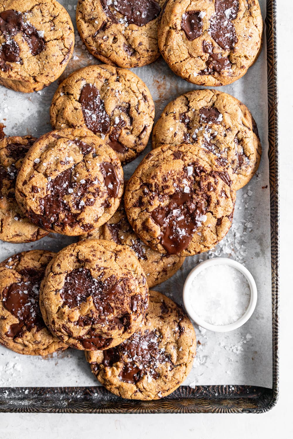 Dark Chocolate Peanut Butter Stuffed Chocolate Chip Cookies. Discs of Dark Chocolate Peanut Butter are stuffed into the middle of a no chill chocolate chip cookie for the most perfect peanut butter stuffed cookie situation. #peanutbutter #peanutbutterstuffedcookie #stuffedcookie