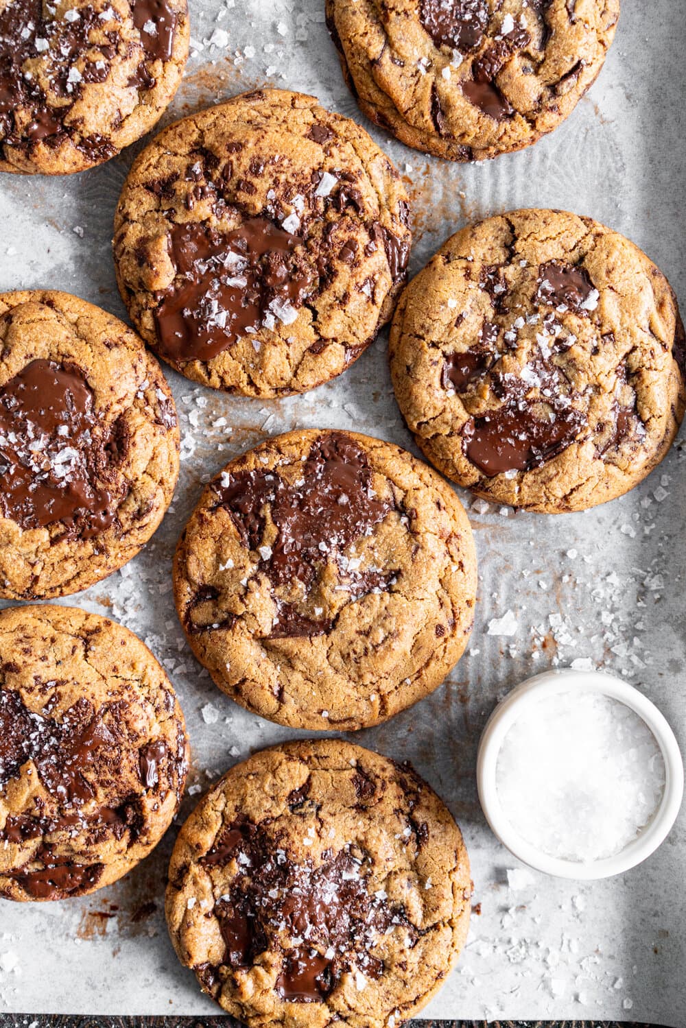 Dark Chocolate Peanut Butter Stuffed Chocolate Chip Cookies. Discs of Dark Chocolate Peanut Butter are stuffed into the middle of a no chill chocolate chip cookie for the most perfect peanut butter stuffed cookie situation. #peanutbutter #peanutbutterstuffedcookie #stuffedcookie