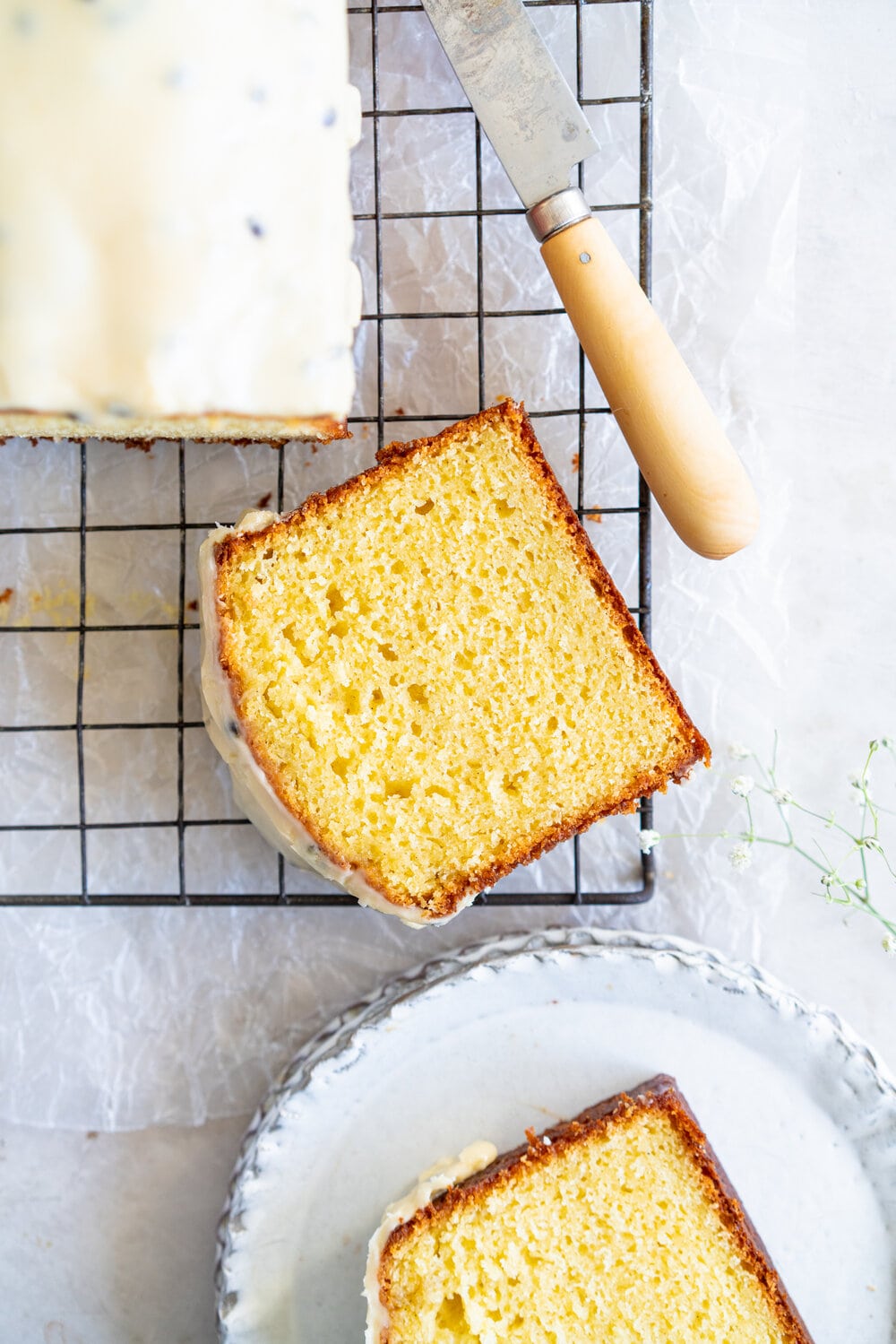 Olive Oil Passionfruit Loaf Cake. This passionfruit loaf cake has floral olive oil and a perfect texture from greek yogurt, and is brushed with a passionfruit syrup and finished with a passionfruit icing #passionfruit #loafcake #passionfruitloafcake