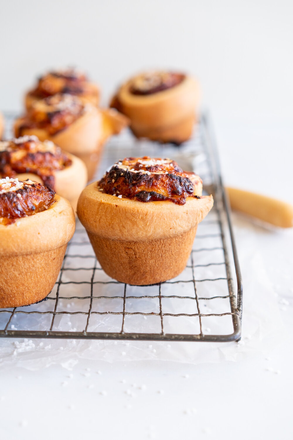 Sharp Cheddar cheese and caramelised onion brioche rolls. Fluffy brioche is spread with sweet caramelised onions and sprinkled with grated sharp cheddar, then rolled into perfect rolls and baked to perfection - cheesy onion goodness. These are easy to make and make the perfect savoury breakfast or brunch treat.