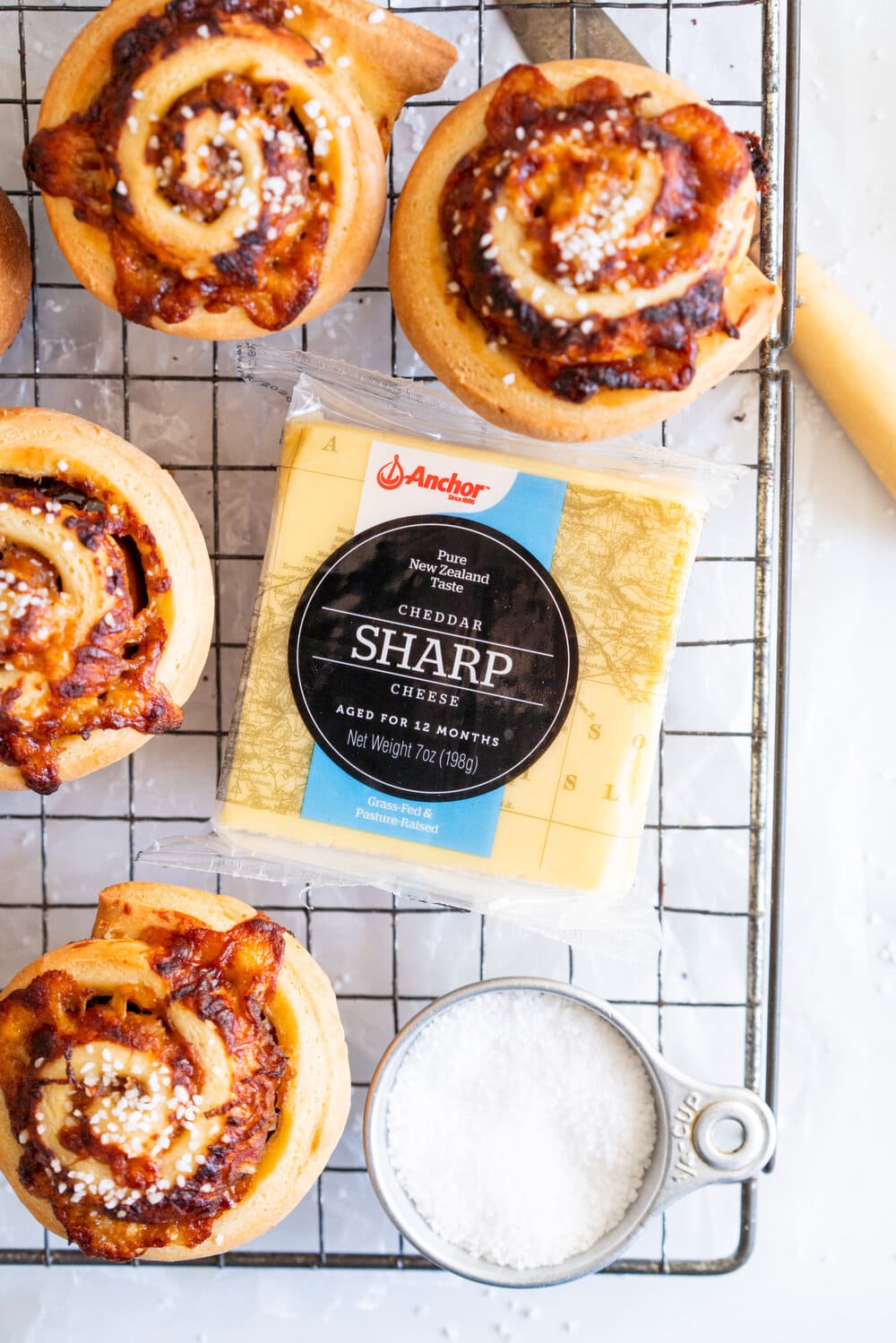 Sharp Cheddar cheese and caramelised onion brioche rolls. Fluffy brioche is spread with sweet caramelised onions and sprinkled with grated sharp cheddar, then rolled into perfect rolls and baked to perfection - cheesy onion goodness. These are easy to make and make the perfect savoury breakfast or brunch treat.
