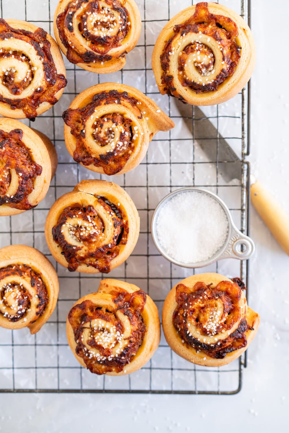 Sharp Cheddar cheese and caramelised onion brioche rolls. Fluffy brioche is spread with sweet caramelised onions and sprinkled with grated sharp cheddar, then rolled into perfect rolls and baked to perfection - cheesy onion goodness. These are easy to make and make the perfect savoury breakfast or brunch treat.