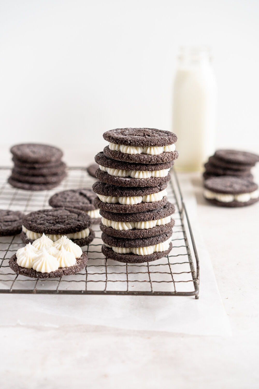 Black Cocoa Sugar Cookie Sandwiches with Cream Cheese Buttercream are the perfect 'grown-up oreo' treat! Soft, chewy black cocoa sugar cookies are paired with a smooth cream cheese frosting to make the perfect sugar cookie sandwich.